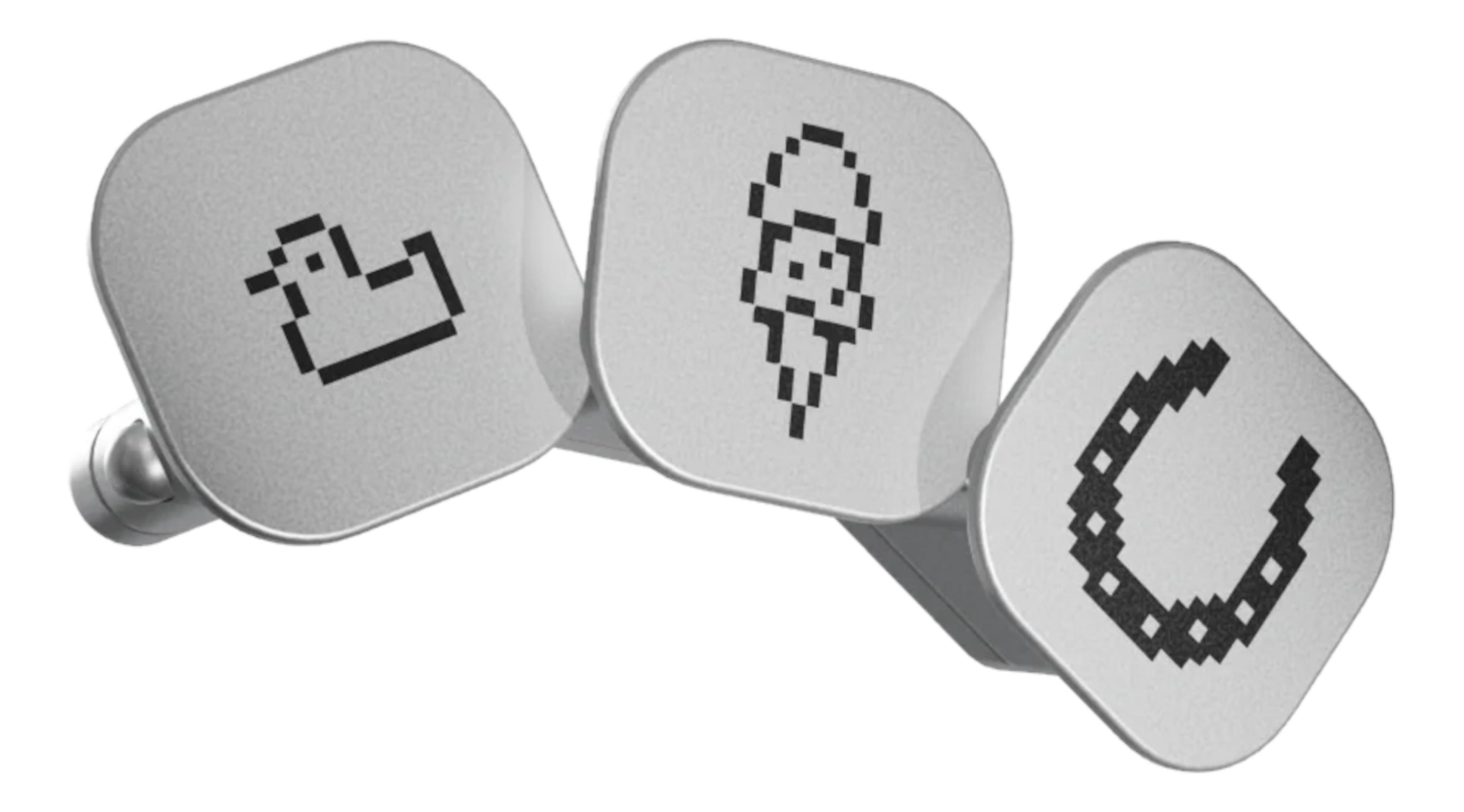 Trois boutons gris avec icônes pixelisées : canard, glace, fer à cheval.