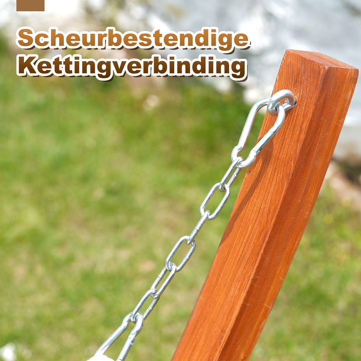 Metal chain with carabiner attached to a wooden post, blurred green background.