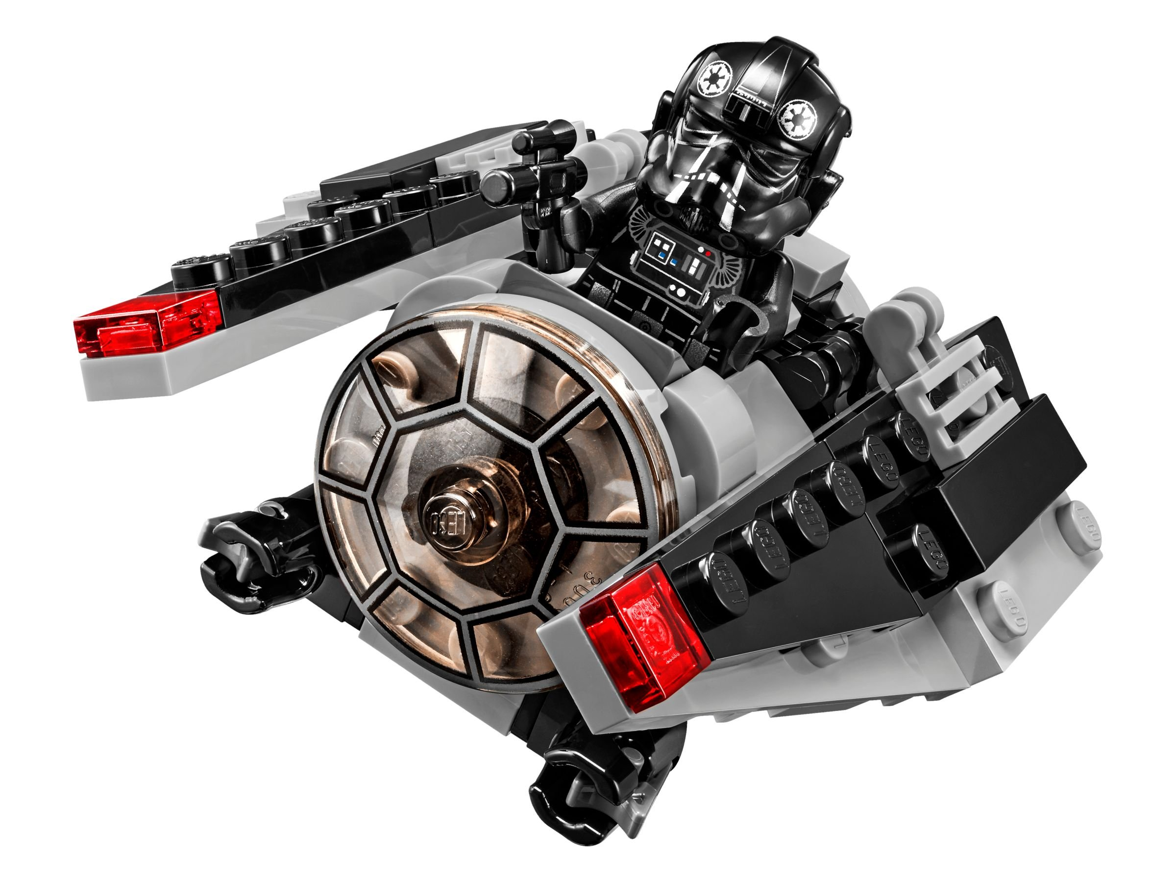 Ein schwarzer Lego-Tie-Fighter-Pilot sitzt in einem grauen und schwarzen Lego-Schiff mit roten Lichtern.