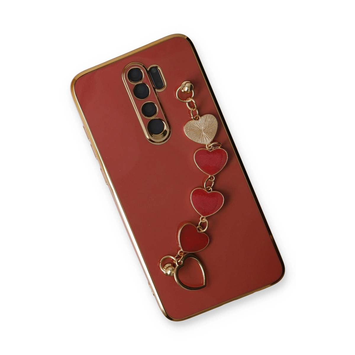 Kalp figürlü, altın kenarlı kırmızı telefon kılıfı.