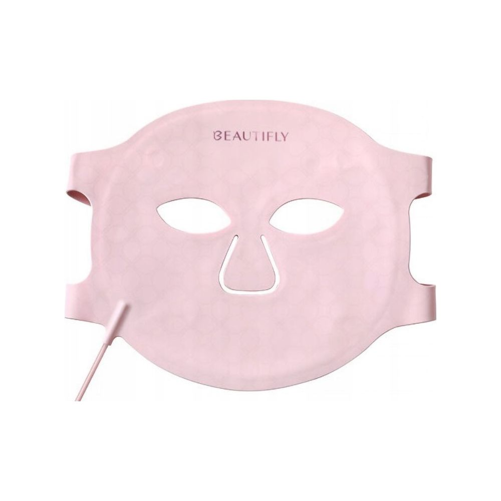 Eine rosafarbene Gesichtsmaske mit Augen- und Mundöffnungen und einem Kabel.
