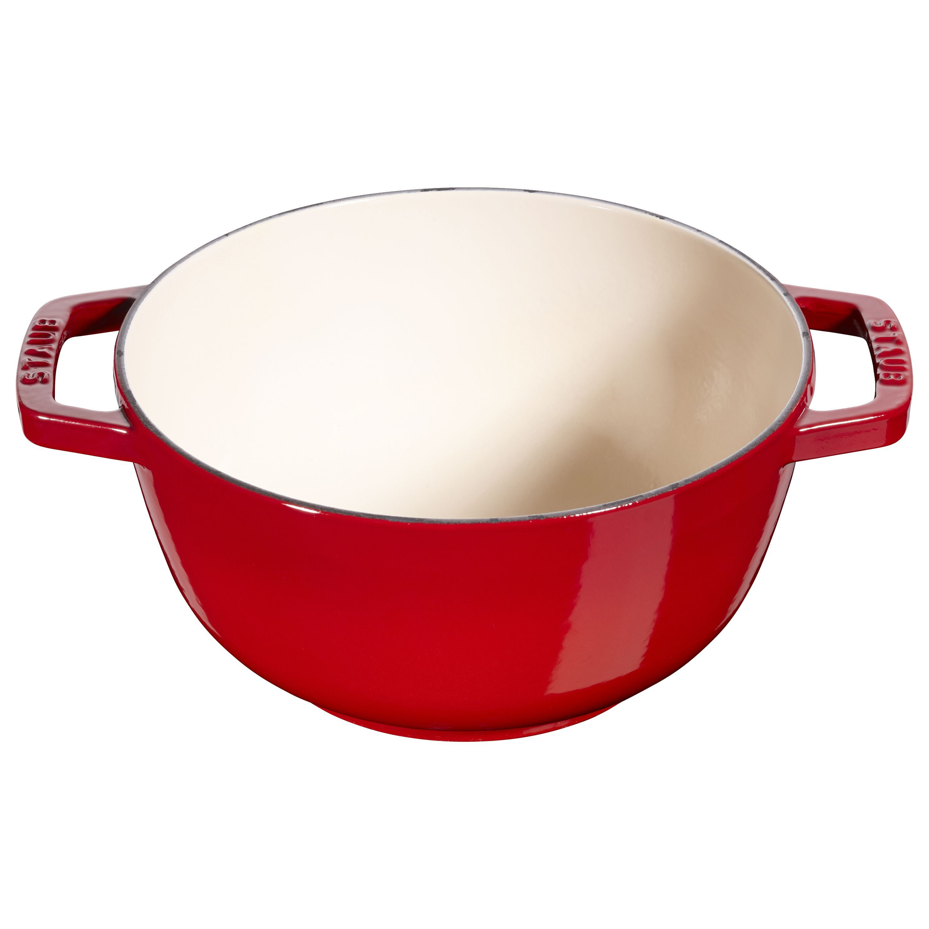 Una pentola in ghisa smaltata rossa con interno crema e due manici.