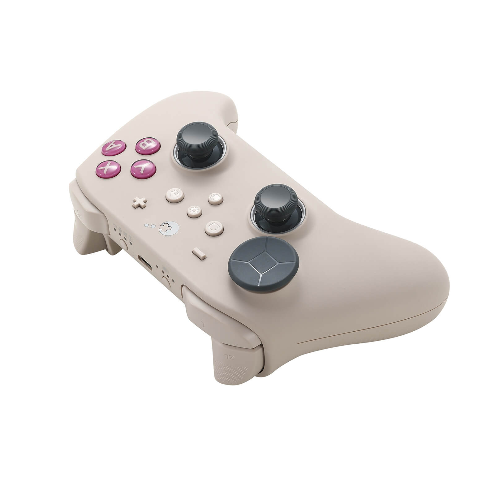 Un mando de juegos beige con joysticks grises y botones rosas.