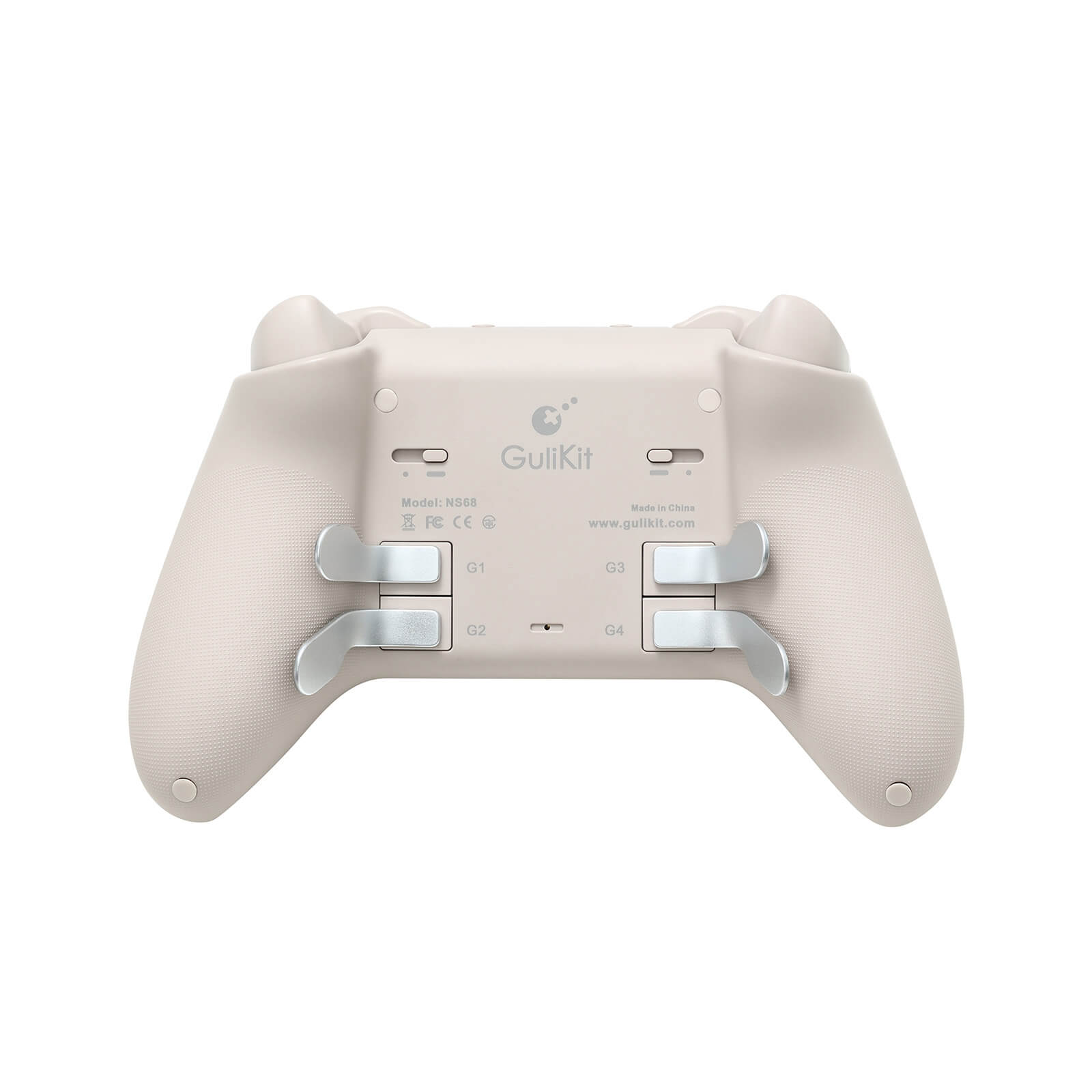 Reverso de un mando de juego beige con cuatro botones plateados etiquetados G1-G4.