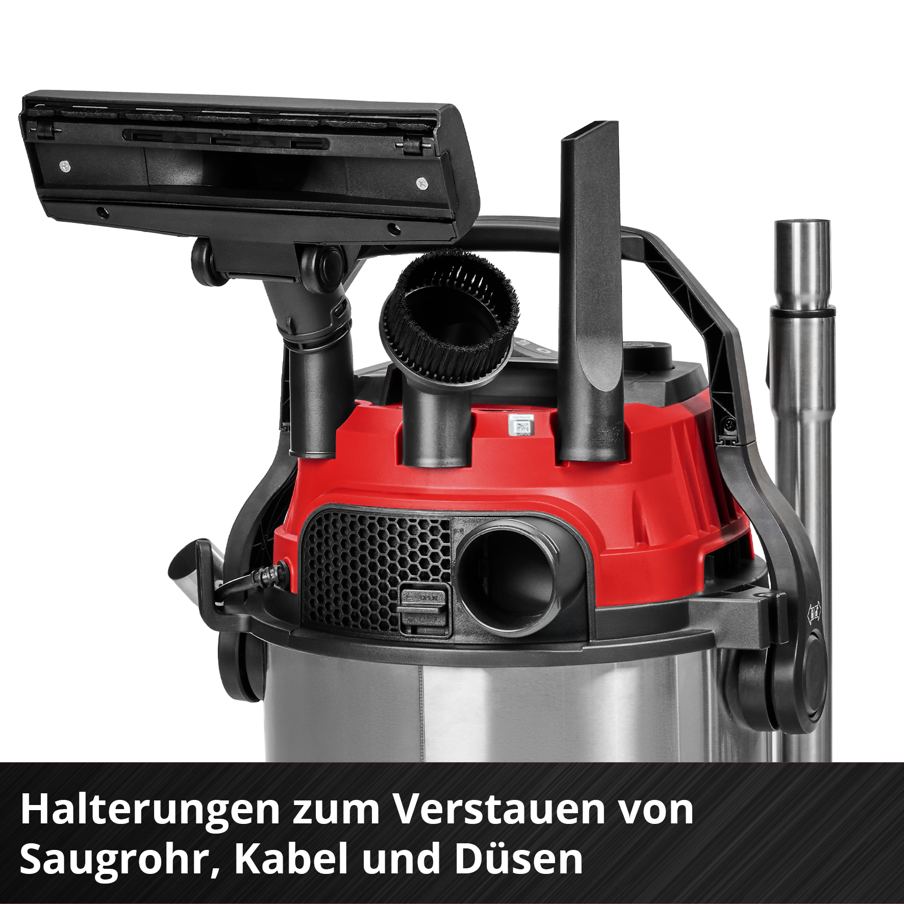 Ein roter Staubsauger mit Zubehör wie Bürste und Düsenhalterungen.