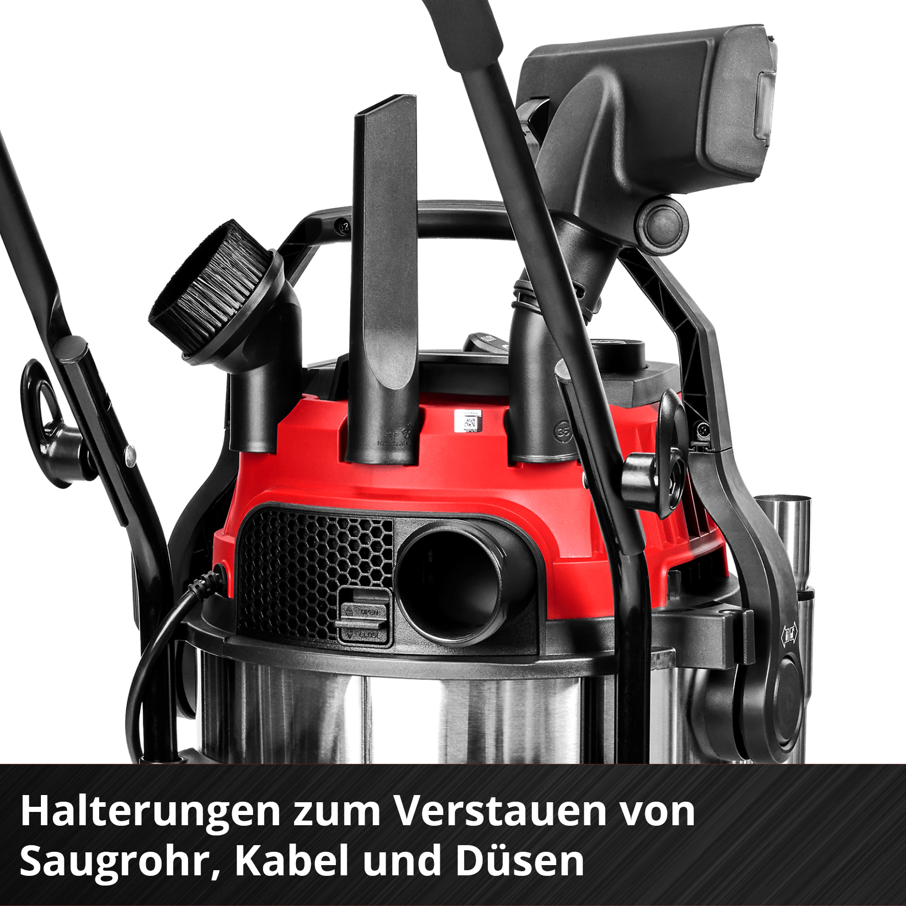 Ein roter Staubsauger mit schwarzen Halterungen für Zubehör.