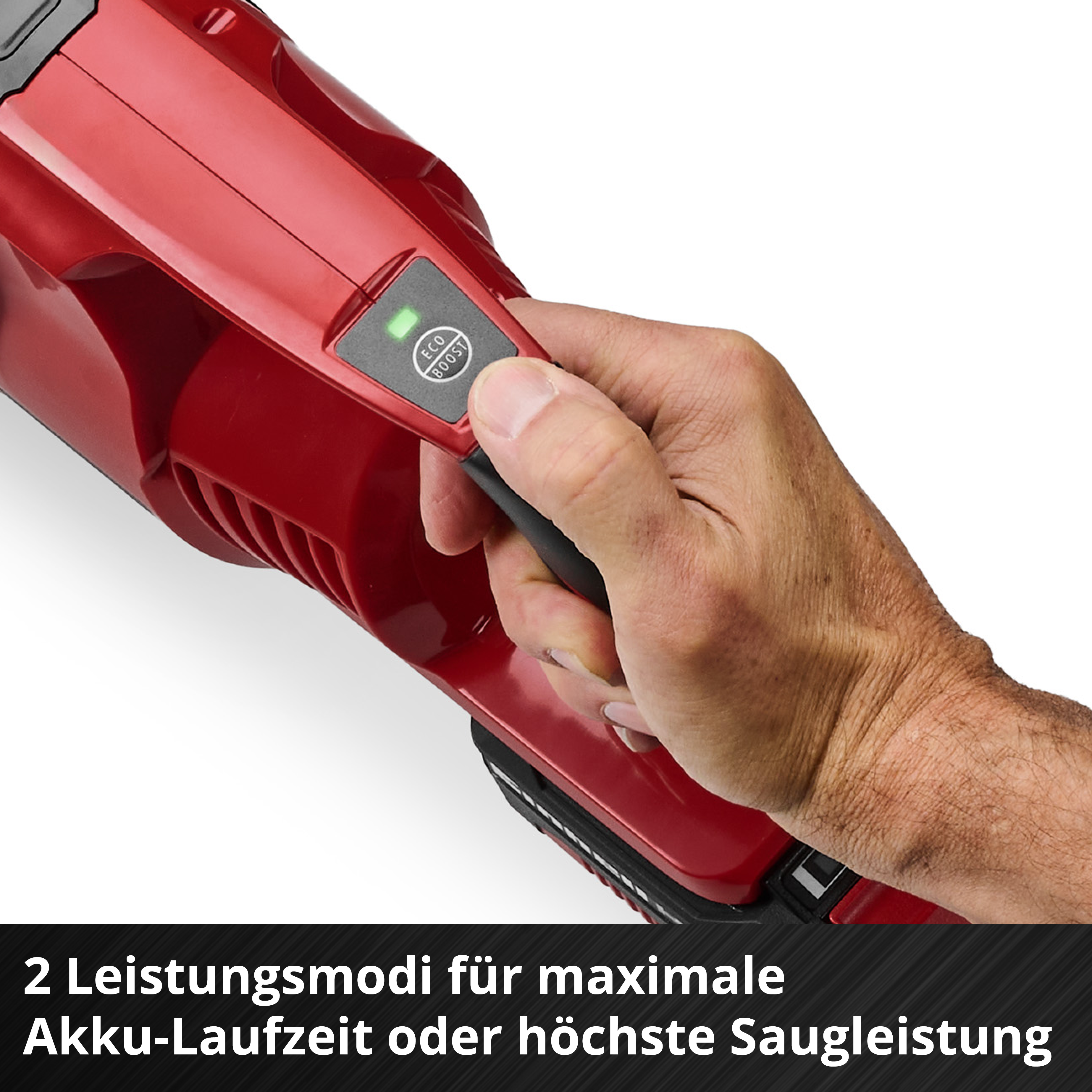 Hand hält roten Staubsauger mit ECO/BOOST-Modus-Anzeige.