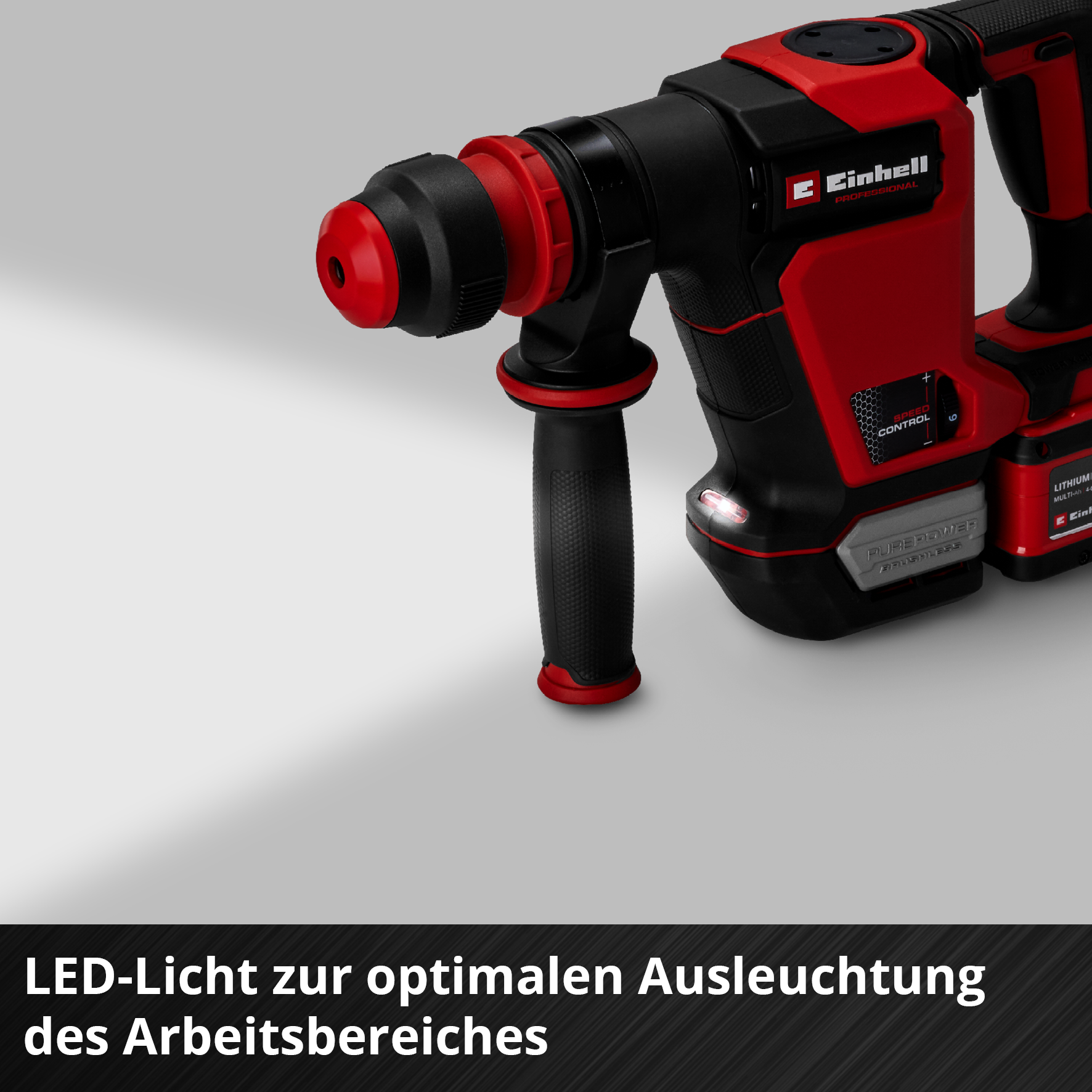 Ein roter und schwarzer Bohrhammer mit LED-Licht und Griff.