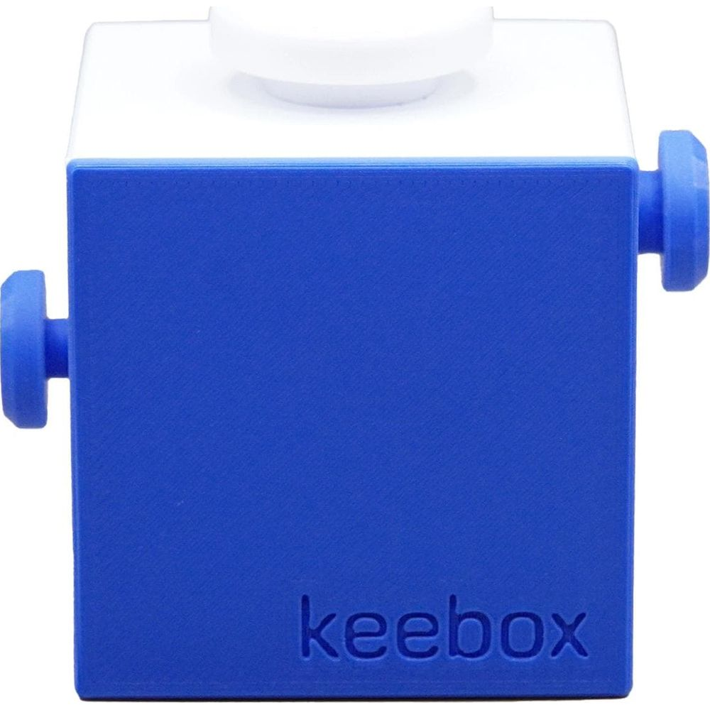 Un cubo blu e bianco con pulsanti sui lati e in alto.