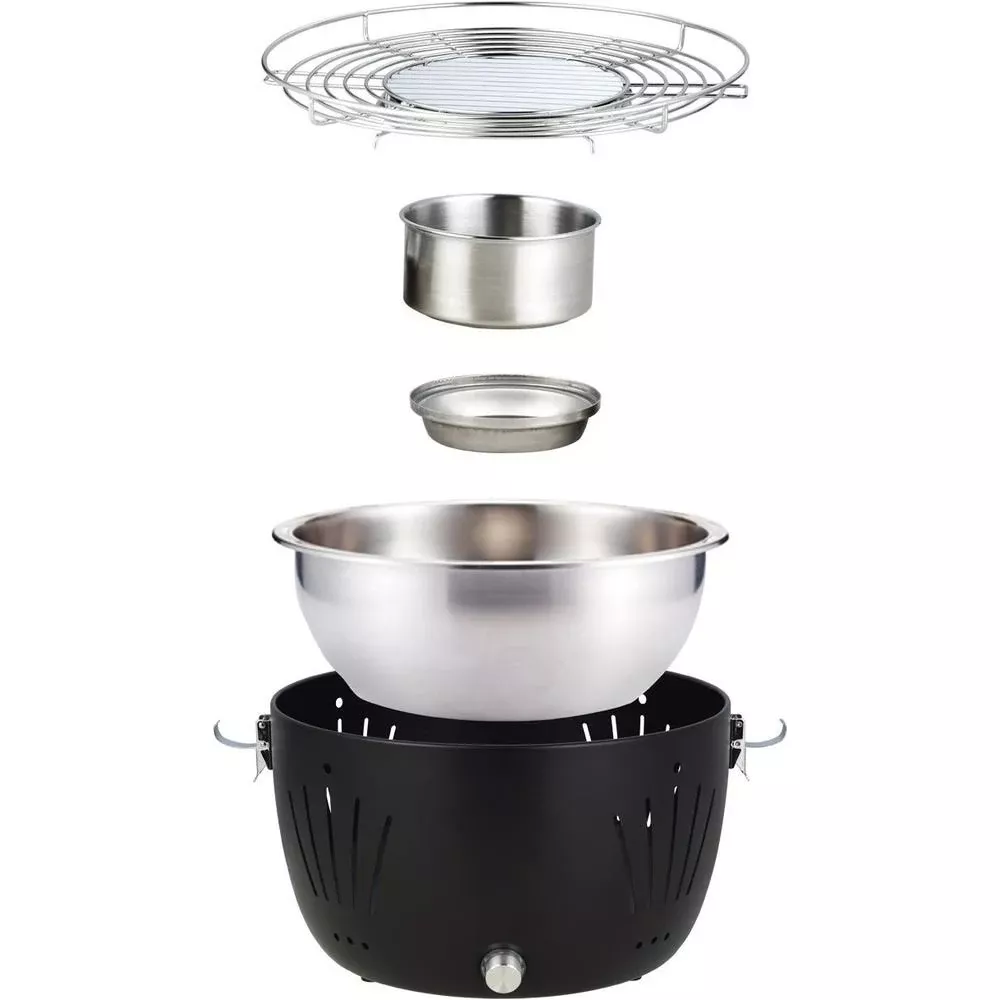 Una griglia nera con diversi inserti in acciaio inox, impilati.