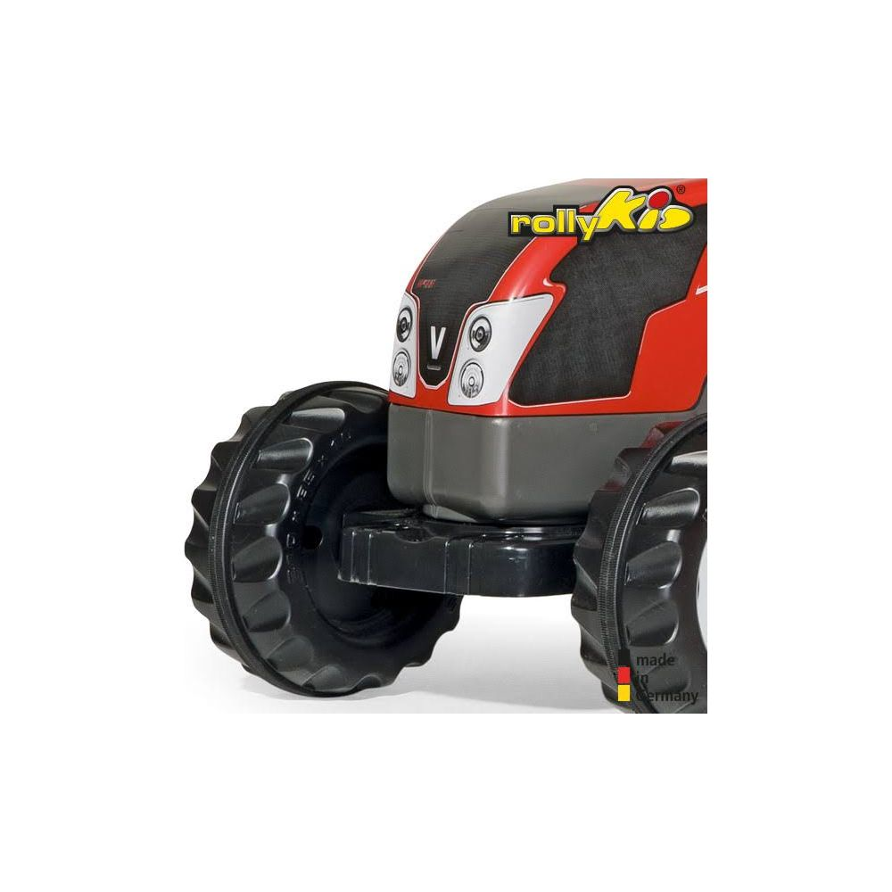 Ein roter Spielzeugtraktor mit großen schwarzen Rädern und dem Logo 