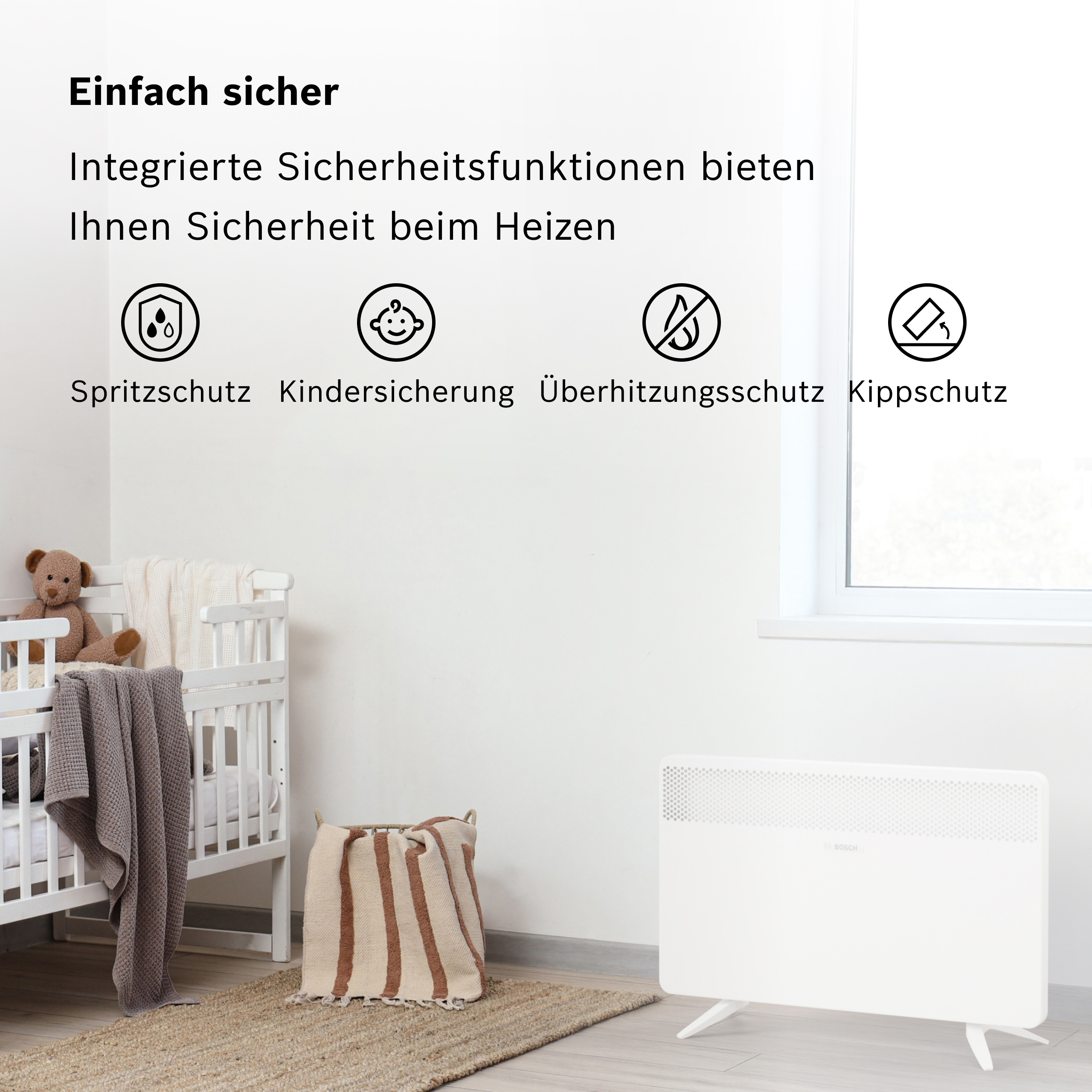 Ein weißer Heizkörper steht neben einem Kinderbett mit Teddybär und Decken.