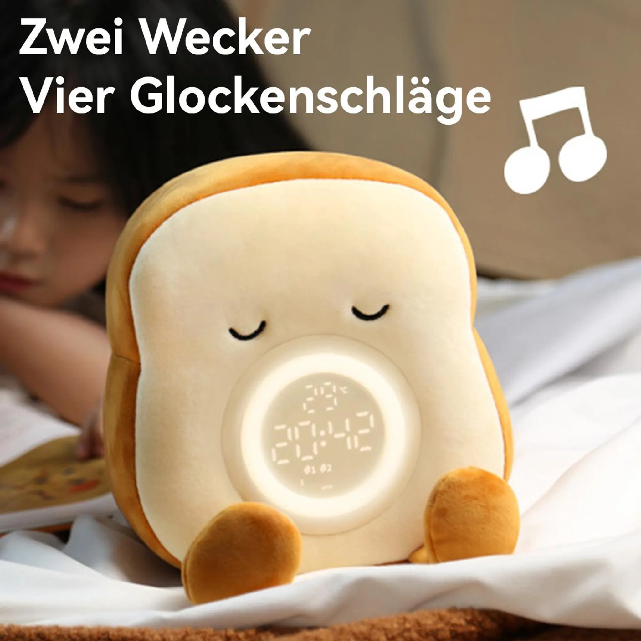 Ein weicher Brotscheiben-Wecker mit digitaler Anzeige schläft neben einem Kind.