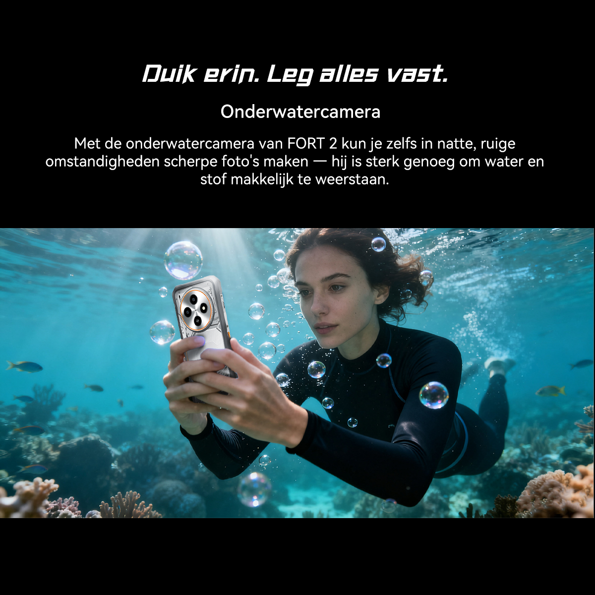 A woman dives and takes photos underwater with a smartphone. Bubbles rise.