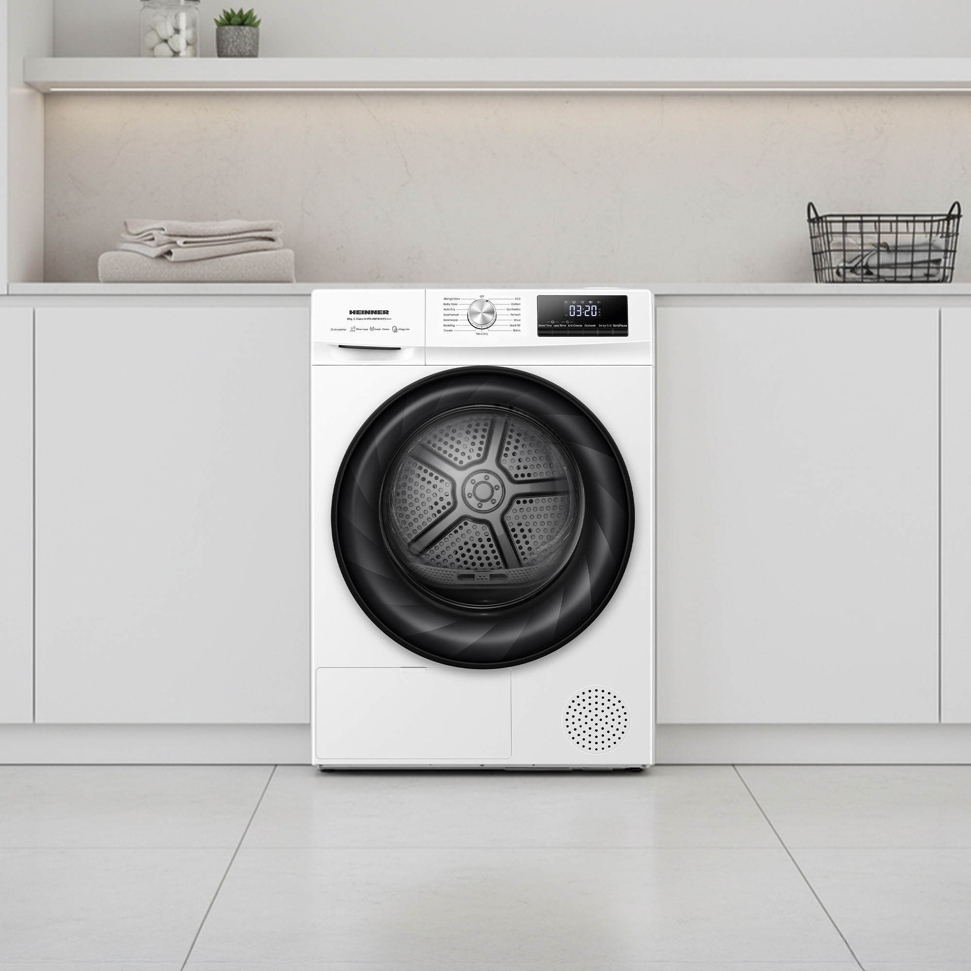 A white clothes dryer with a black door and control panel sits on a light tiled floor.