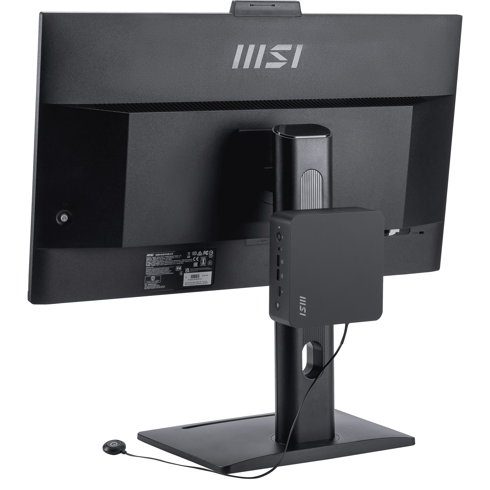 Rear view of a black MSI monitor with a mini PC and round power button attached.