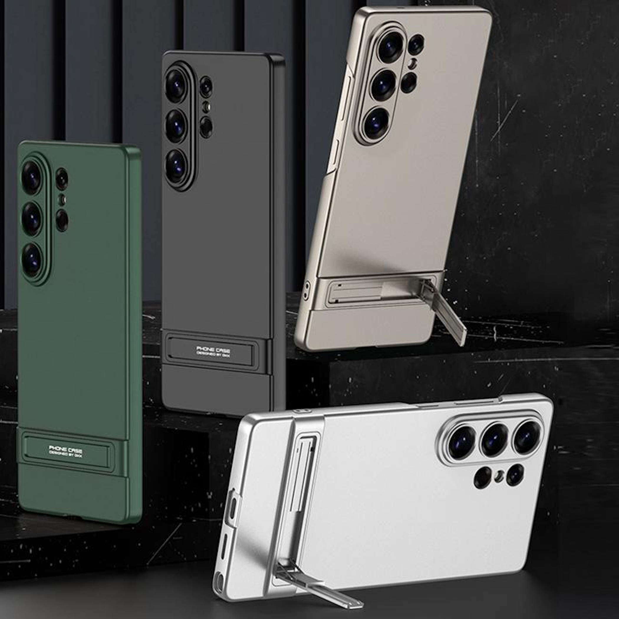 Tres fundas de teléfono en verde, negro y plateado, cada una con soporte.