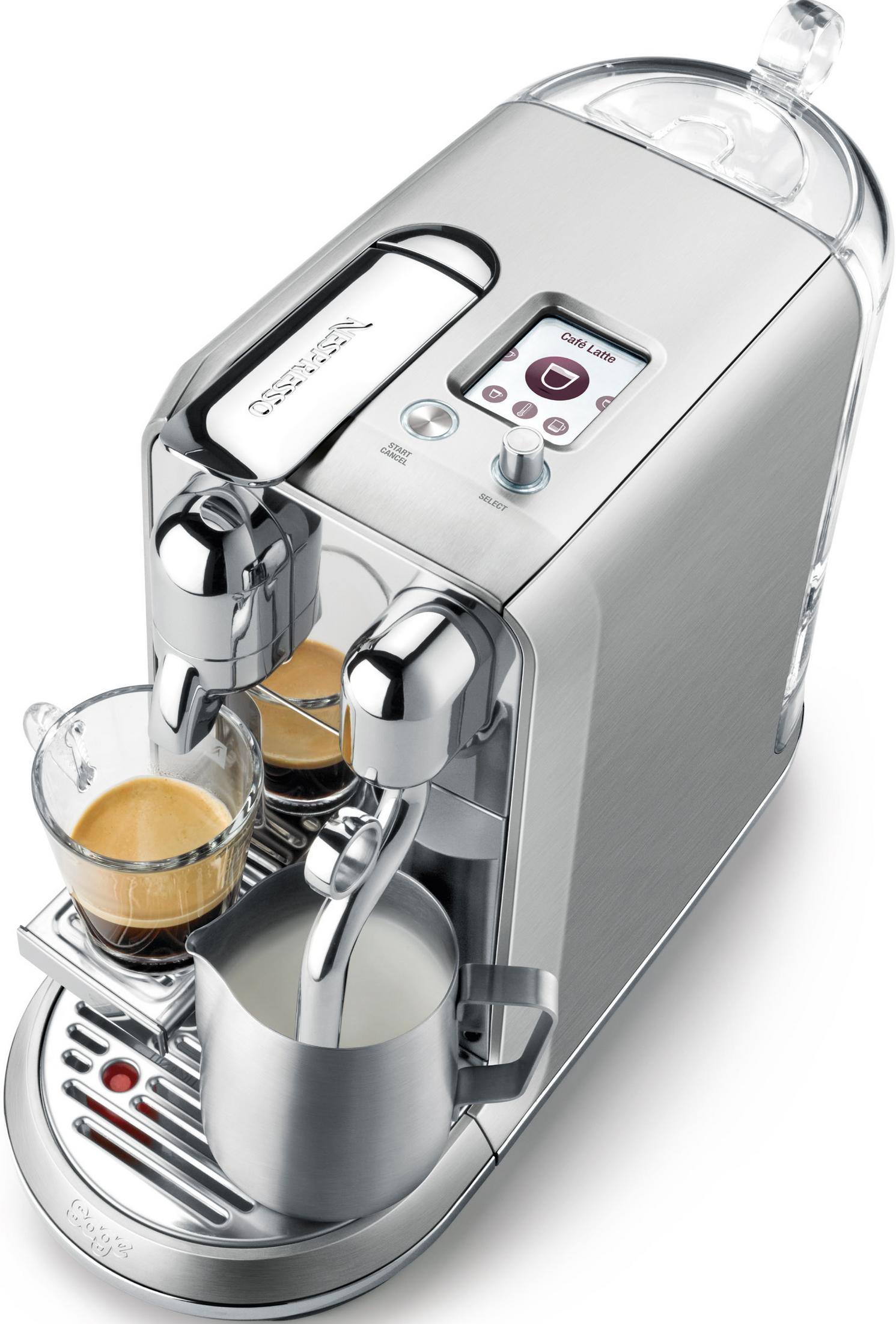 Macchina da caffè argento con caraffa latte e tazzina espresso, logo Nespresso.