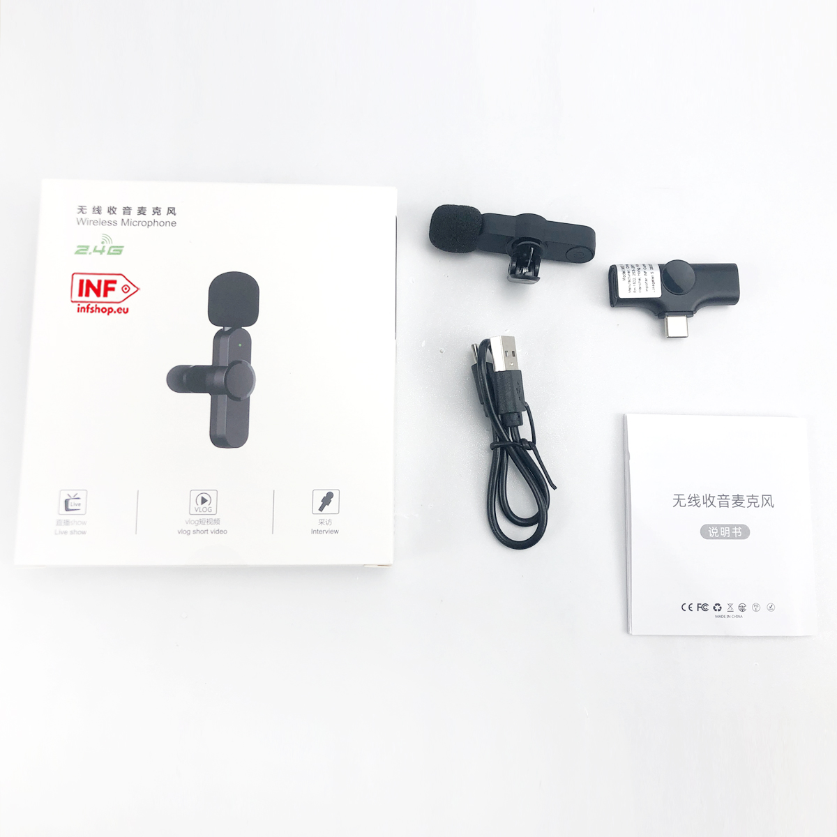 Zestaw mikrofonu bezprzewodowego z akcesoriami, na białym tle.