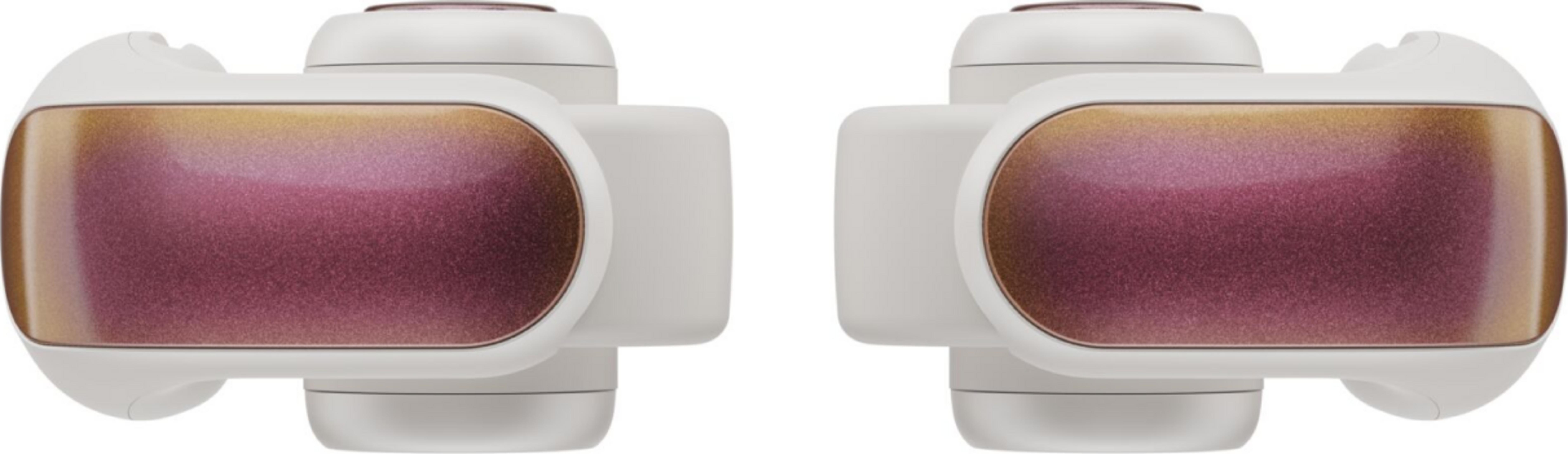 Due auricolari bianchi con accenti scintillanti viola e oro.