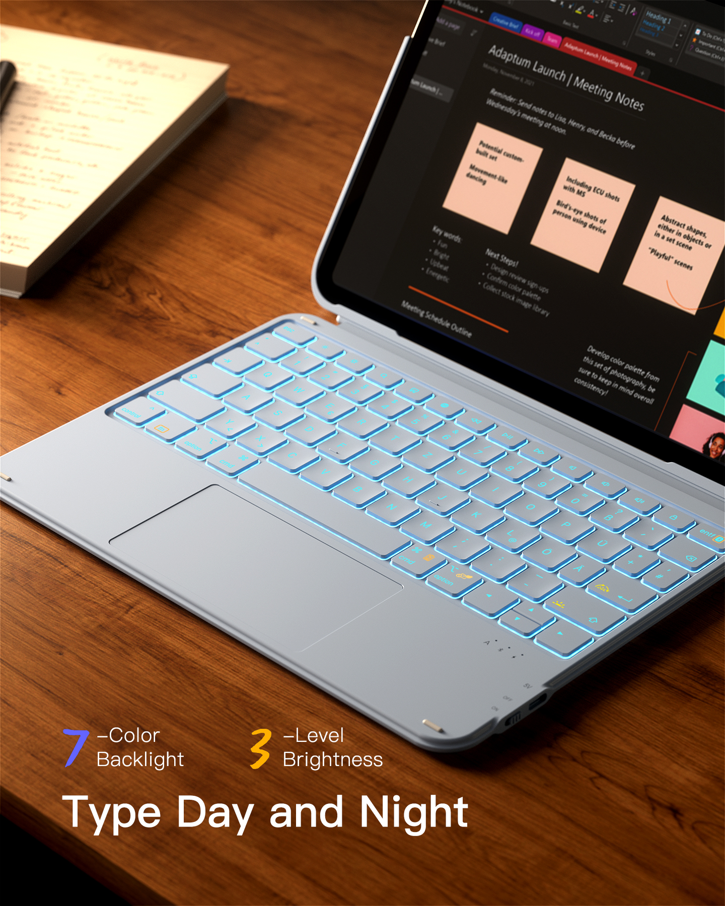 Ein Laptop mit beleuchteter Tastatur und Notizen auf dem Bildschirm.