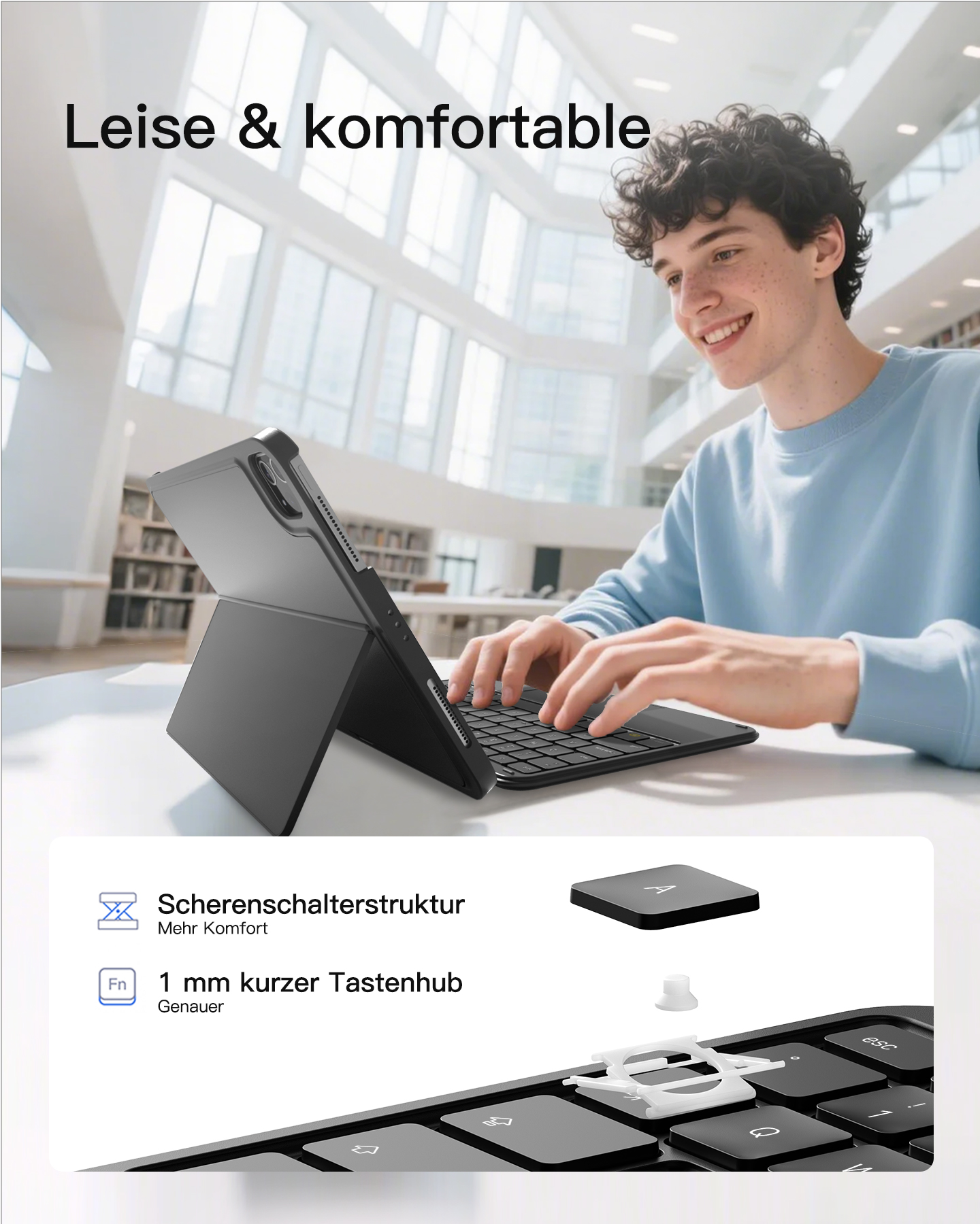 Mann tippt auf Tastatur eines Tablets mit Hülle in hellem Raum.