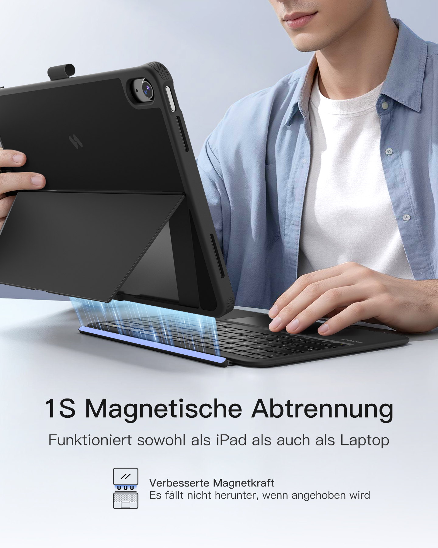 Mann hält ein schwarzes iPad mit Tastatur. Es ist als Laptop konfiguriert.
