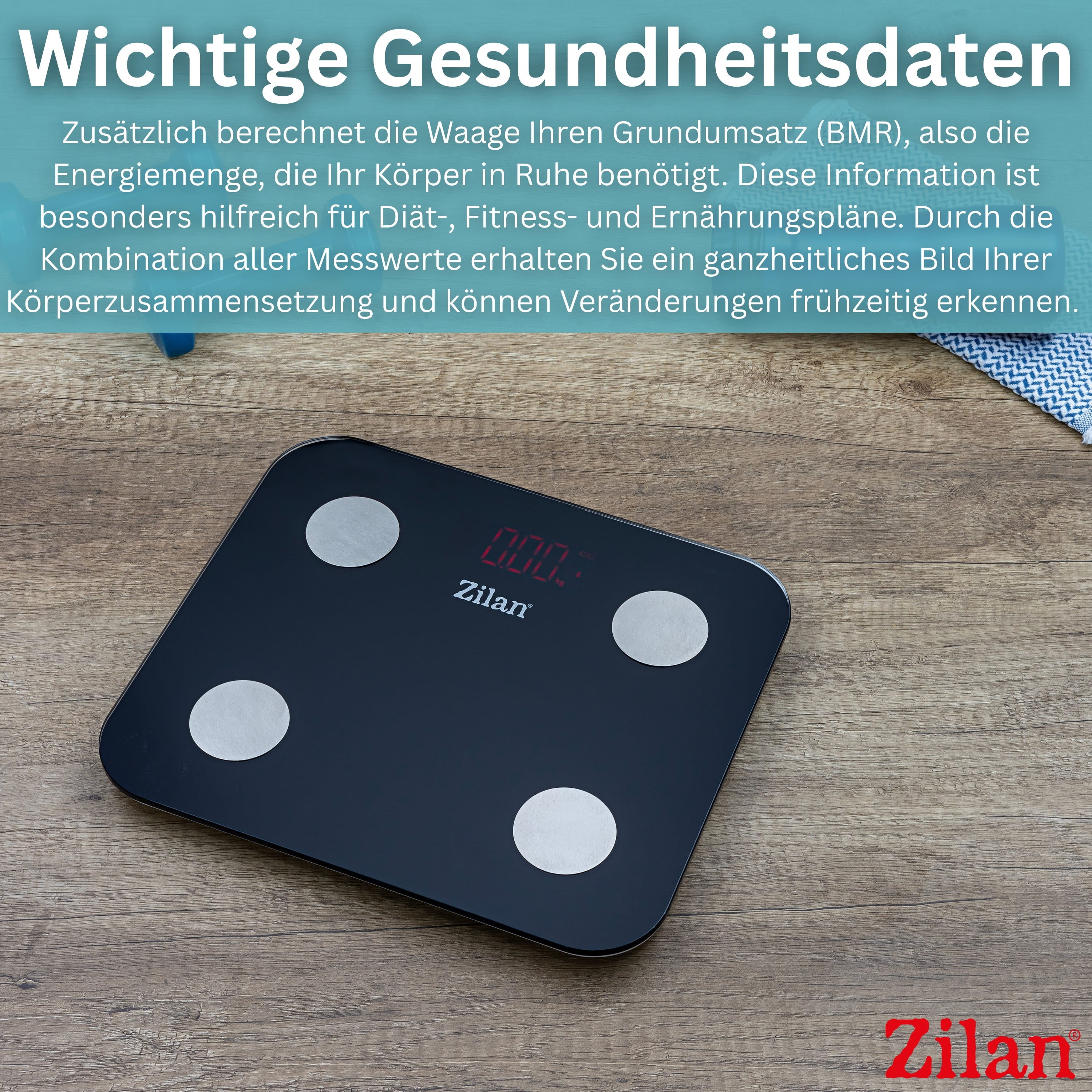 Schwarze digitale Waage mit vier silbernen Elektroden auf Holzhintergrund.