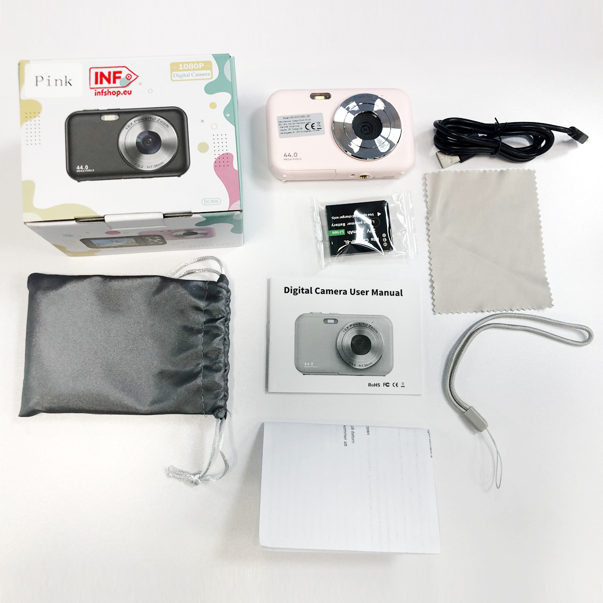 Akcesoria do aparatu cyfrowego: aparat, bateria, kabel, etui, instrukcja.