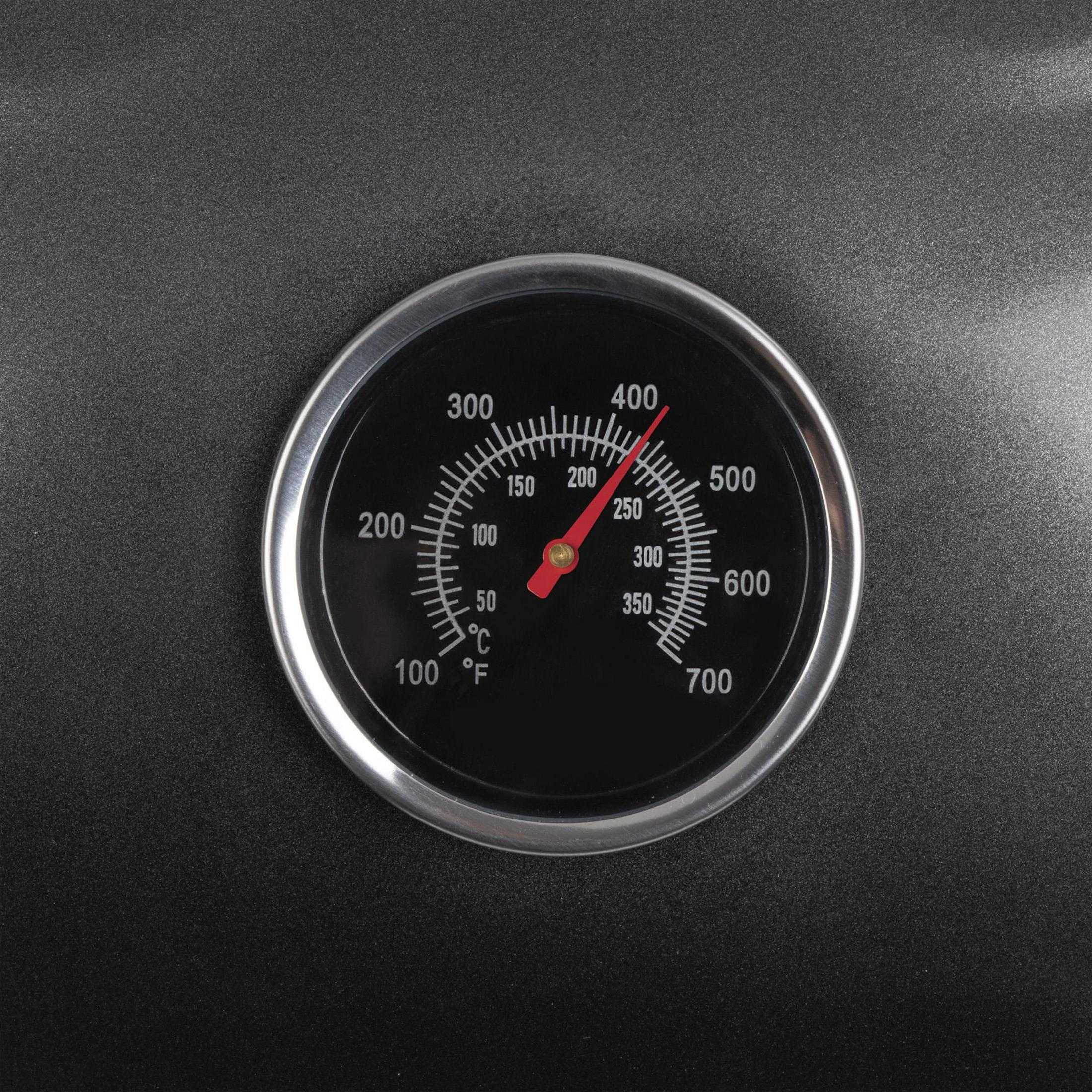 Un termometro su sfondo nero mostra 275 gradi Fahrenheit.