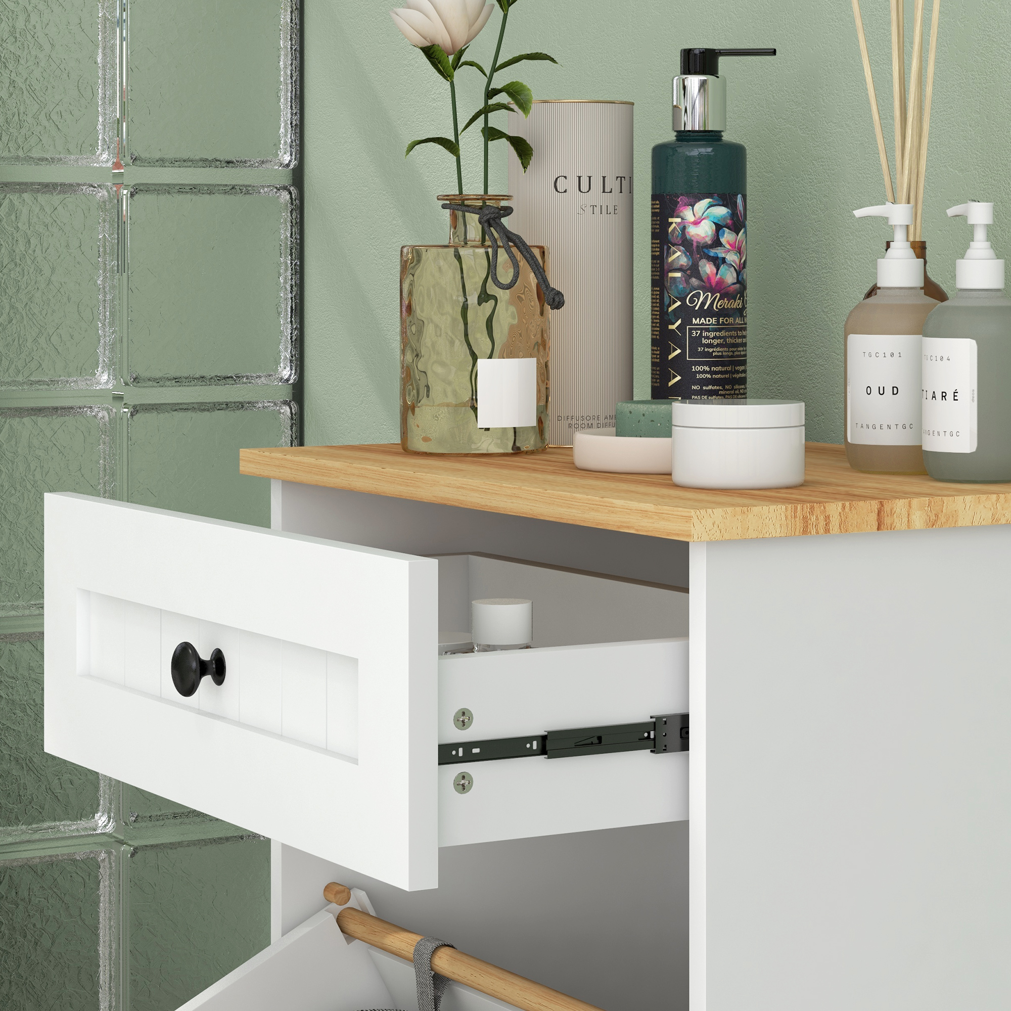 Un mueble blanco con cajón abierto, mostrando artículos de tocador y un gancho de madera.