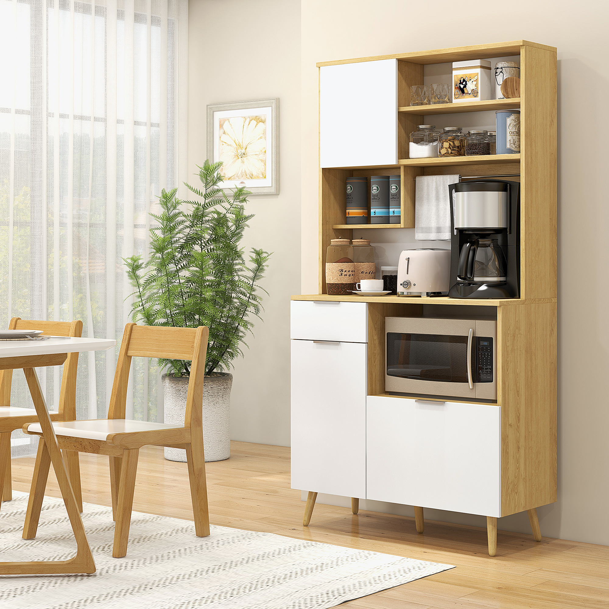 Un armario de madera y blanco con cafetera, microondas y tostadora. Cerca hay una mesa de comedor.