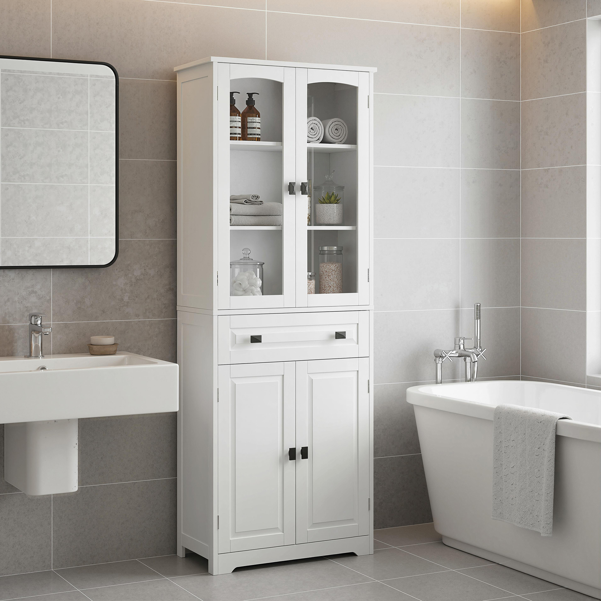 Un mueble de baño blanco junto a una bañera y un lavabo.