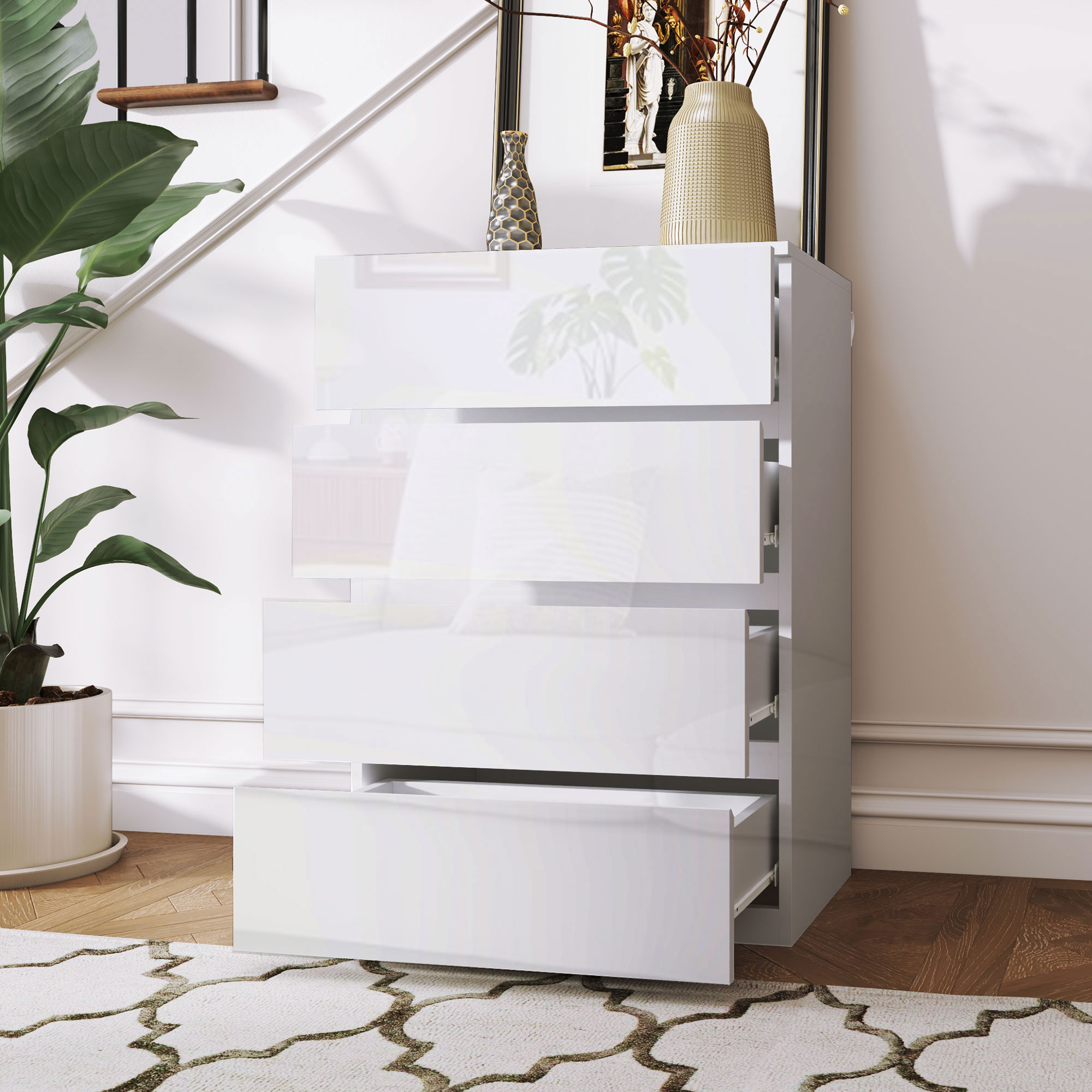 Una cómoda blanca moderna con cuatro cajones junto a una escalera.