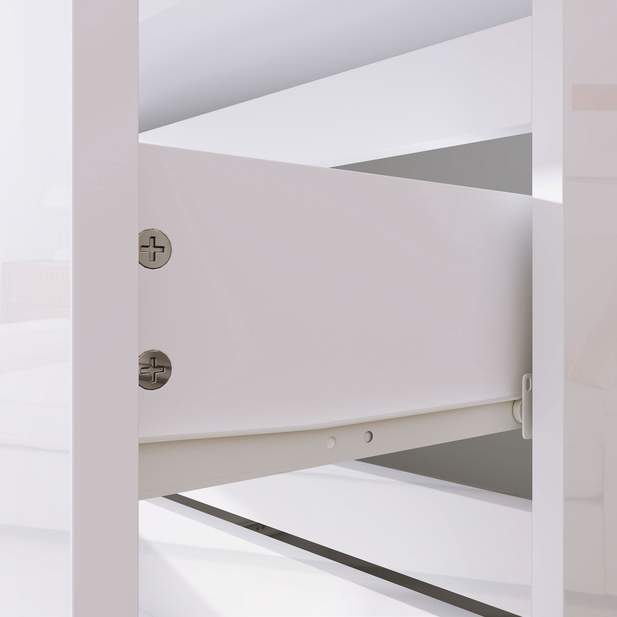 Primer plano de mueble blanco con tornillos visibles y mecanismo de cajón.