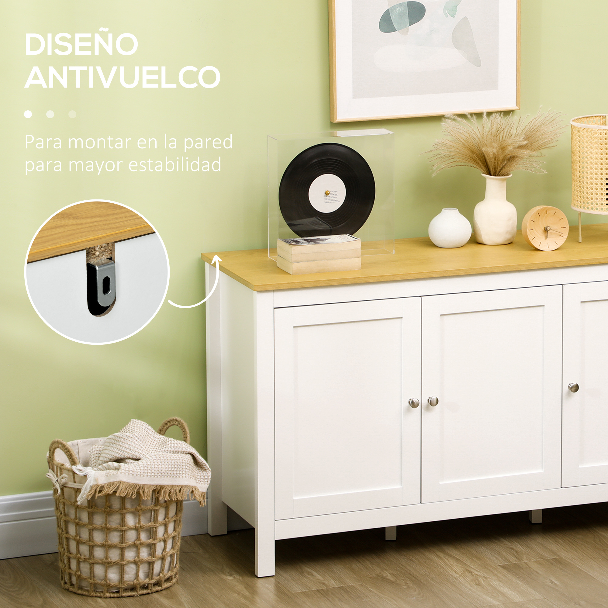 Mueble blanco con tapa de madera, cesta con manta, cuadro sobre mueble.