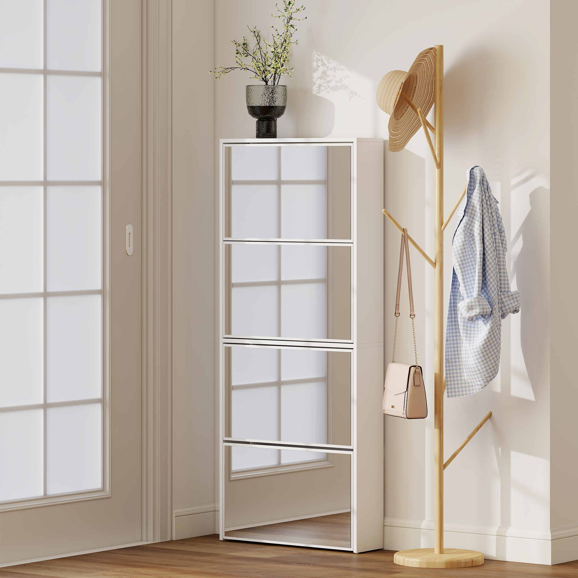 Un armario blanco alto con puertas de espejo junto a un perchero de madera con sombrero y camisa.