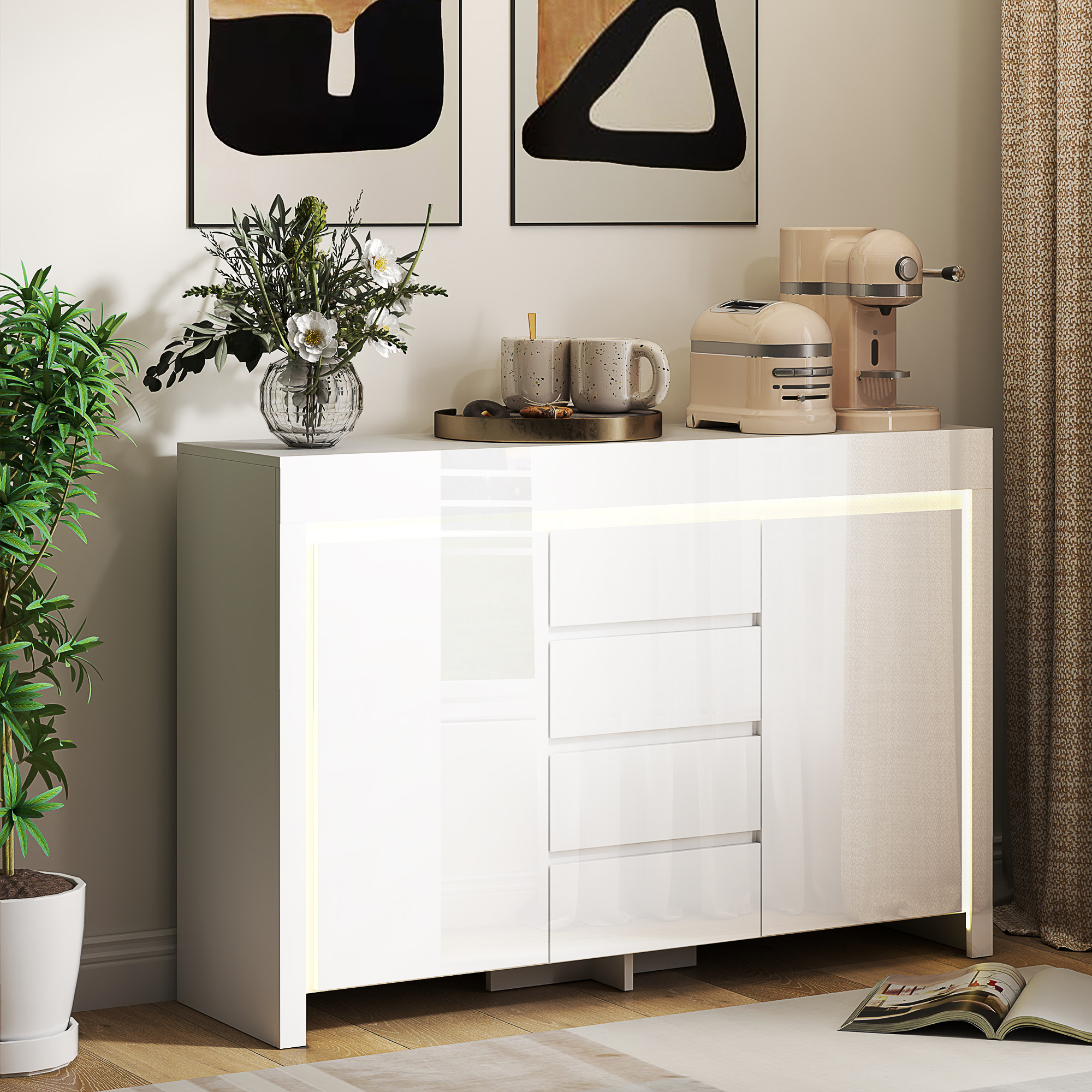 Un aparador blanco con electrodomésticos modernos y arte en la pared.