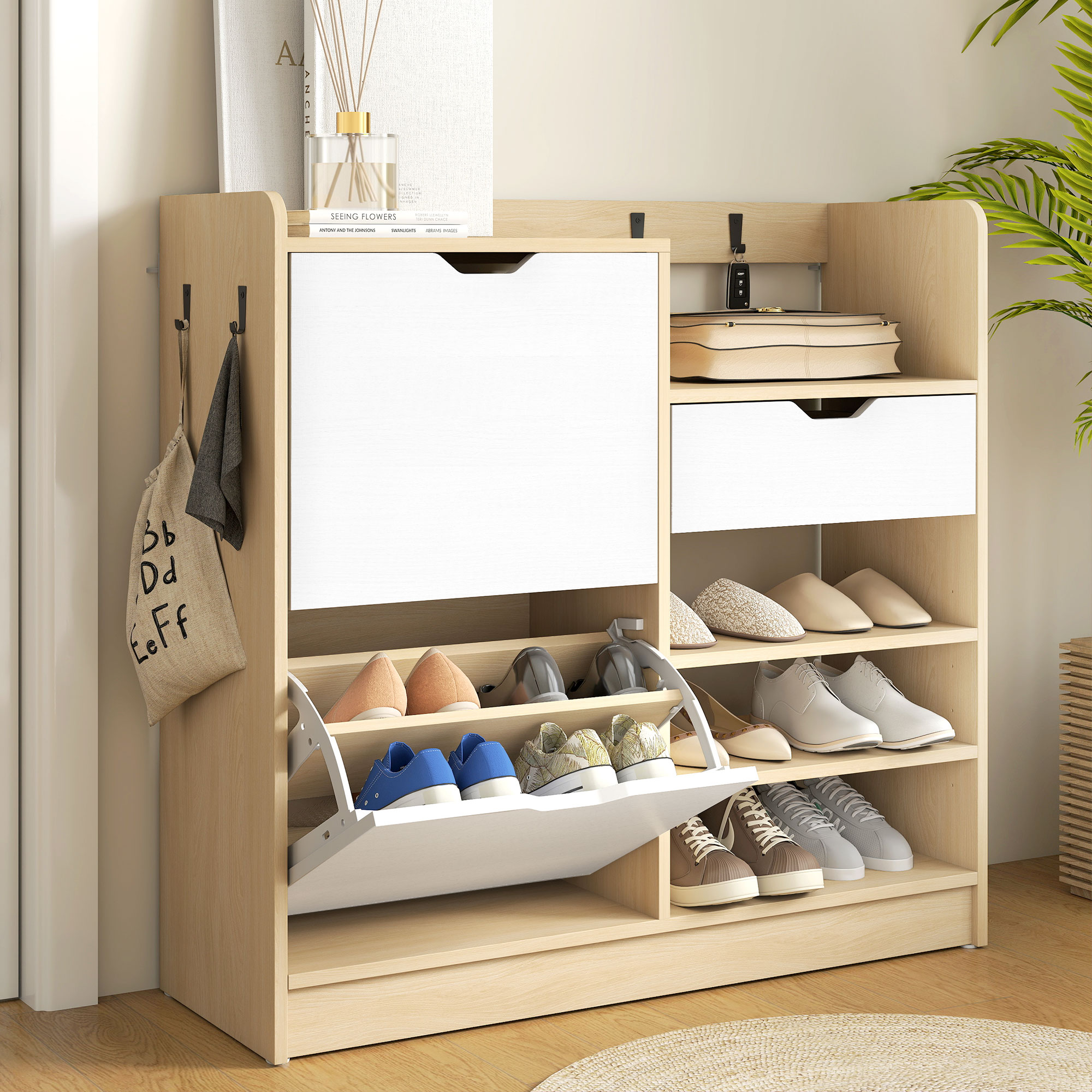 Un zapatero de madera con cajones blancos, zapatos y ganchos.