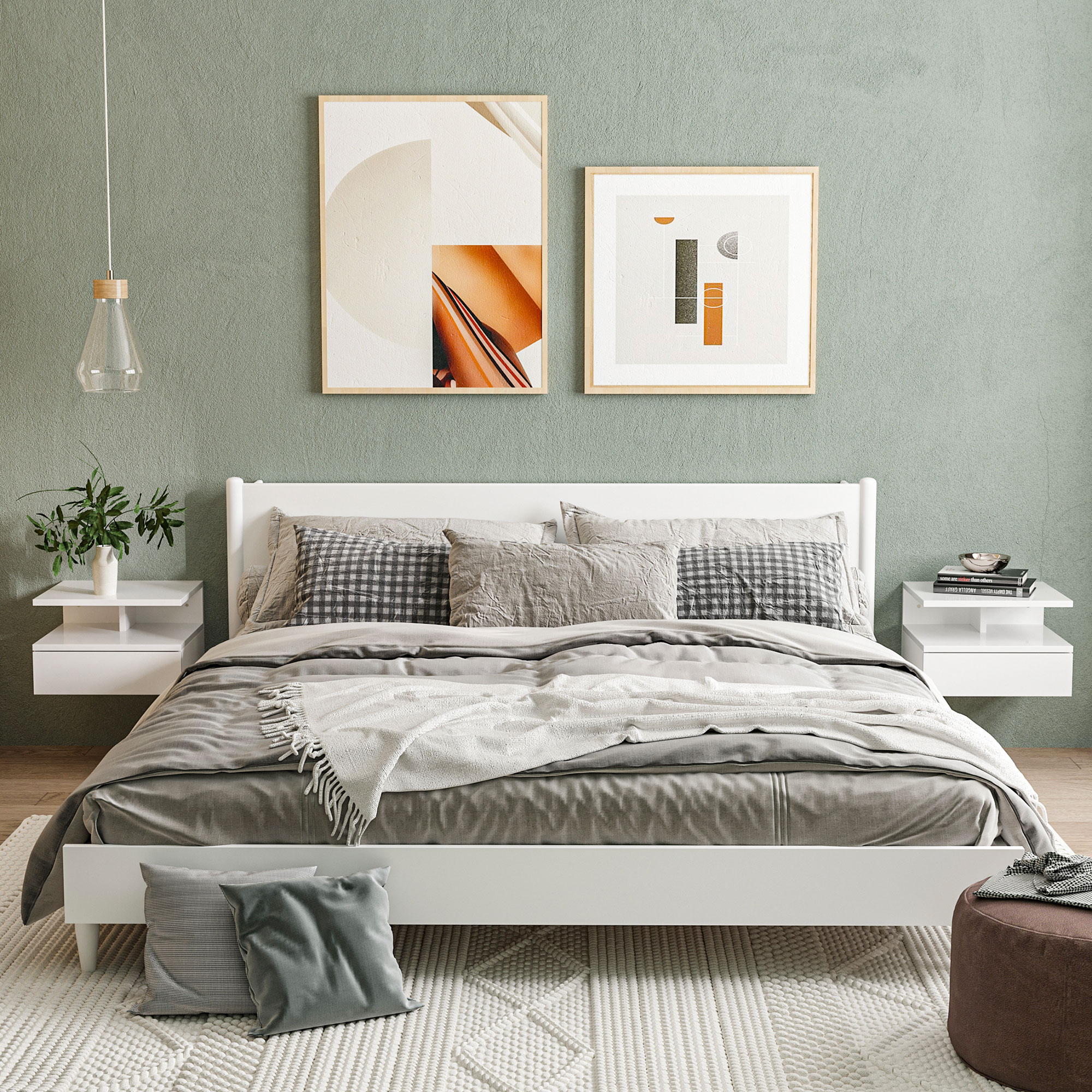 Un dormitorio moderno con cama blanca, cojines y arte en la pared.
