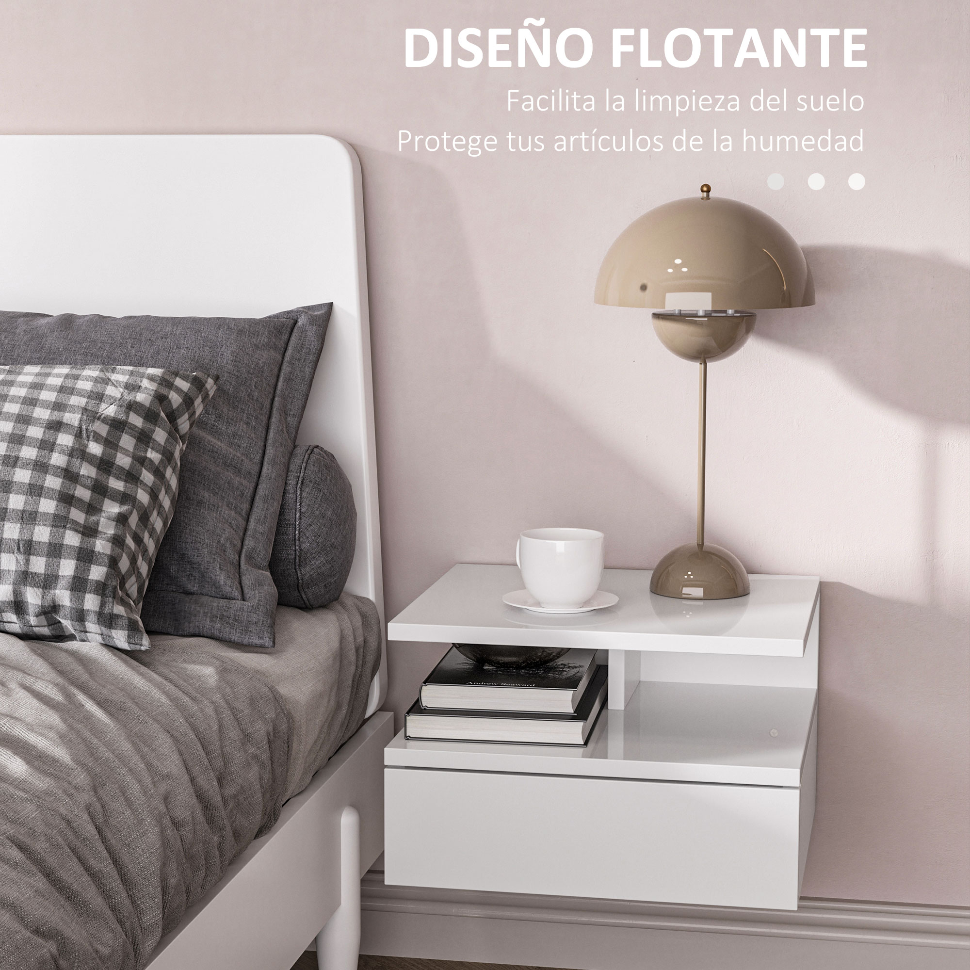 Una mesita de noche junto a una cama con almohadas grises y una lámpara.