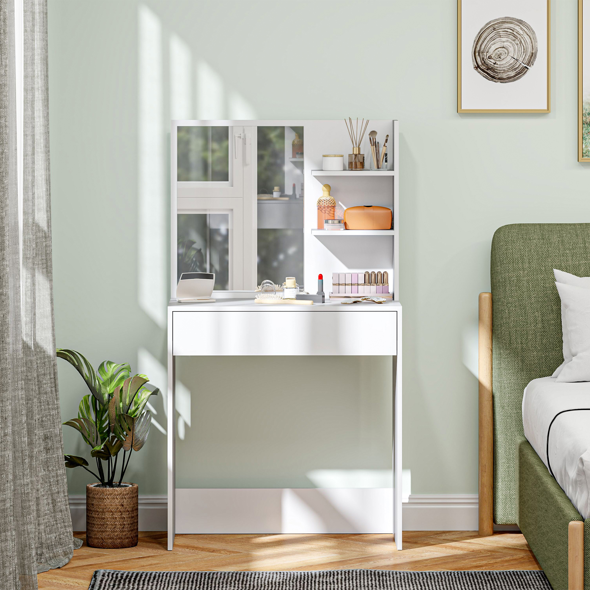 Tocador blanco con espejo y maquillaje, junto a una cama con cabecero verde.