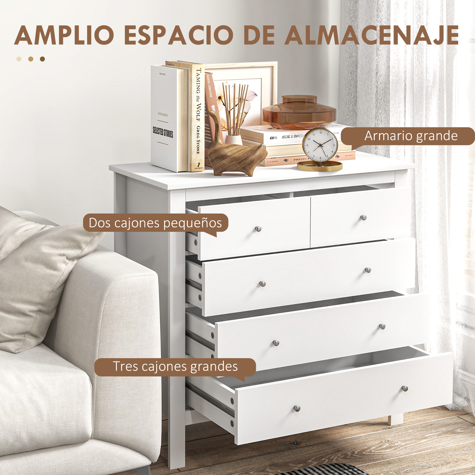 Una cómoda blanca con cajones abiertos junto a un sofá.