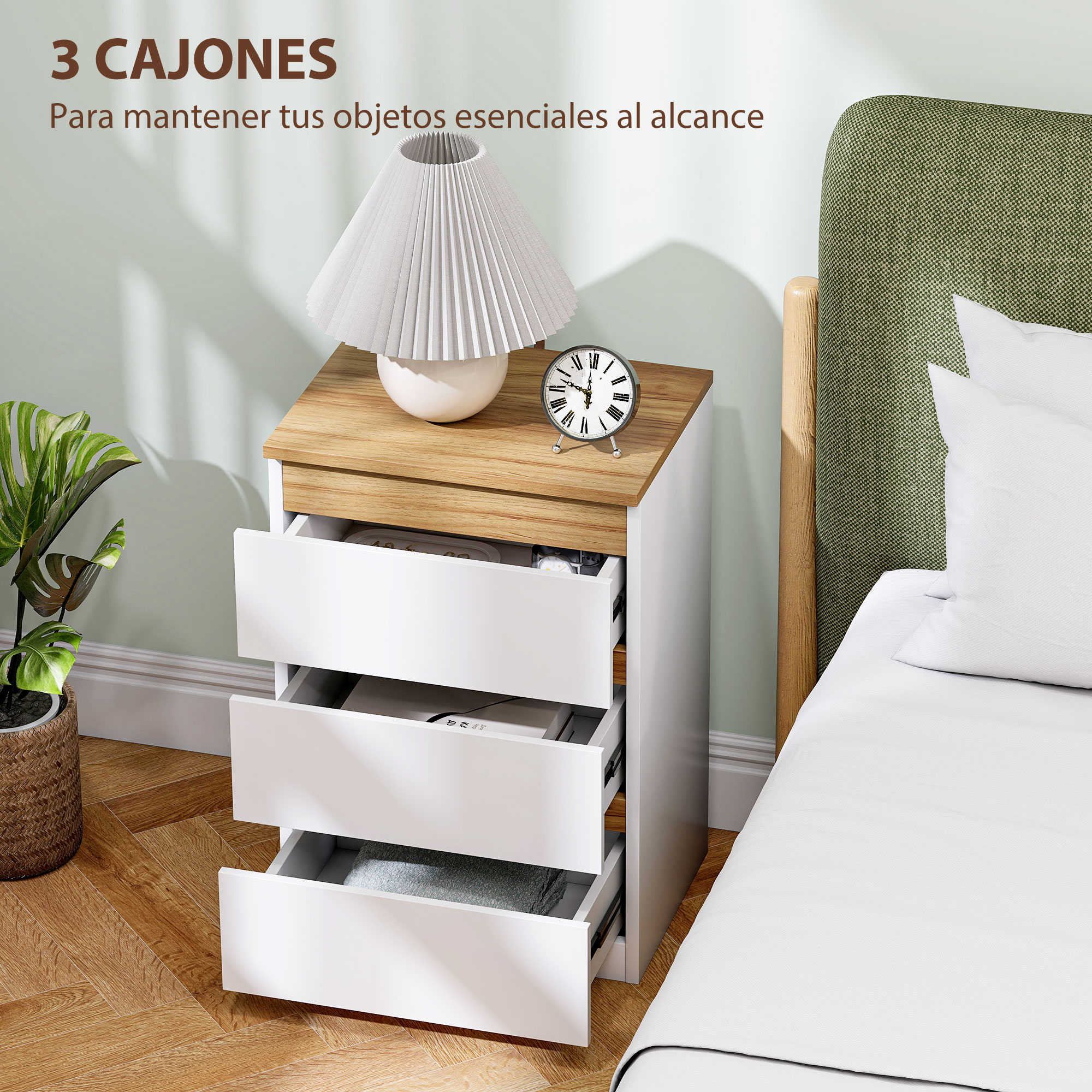 Una mesita de noche blanca de tres cajones junto a una cama con cabecero verde.