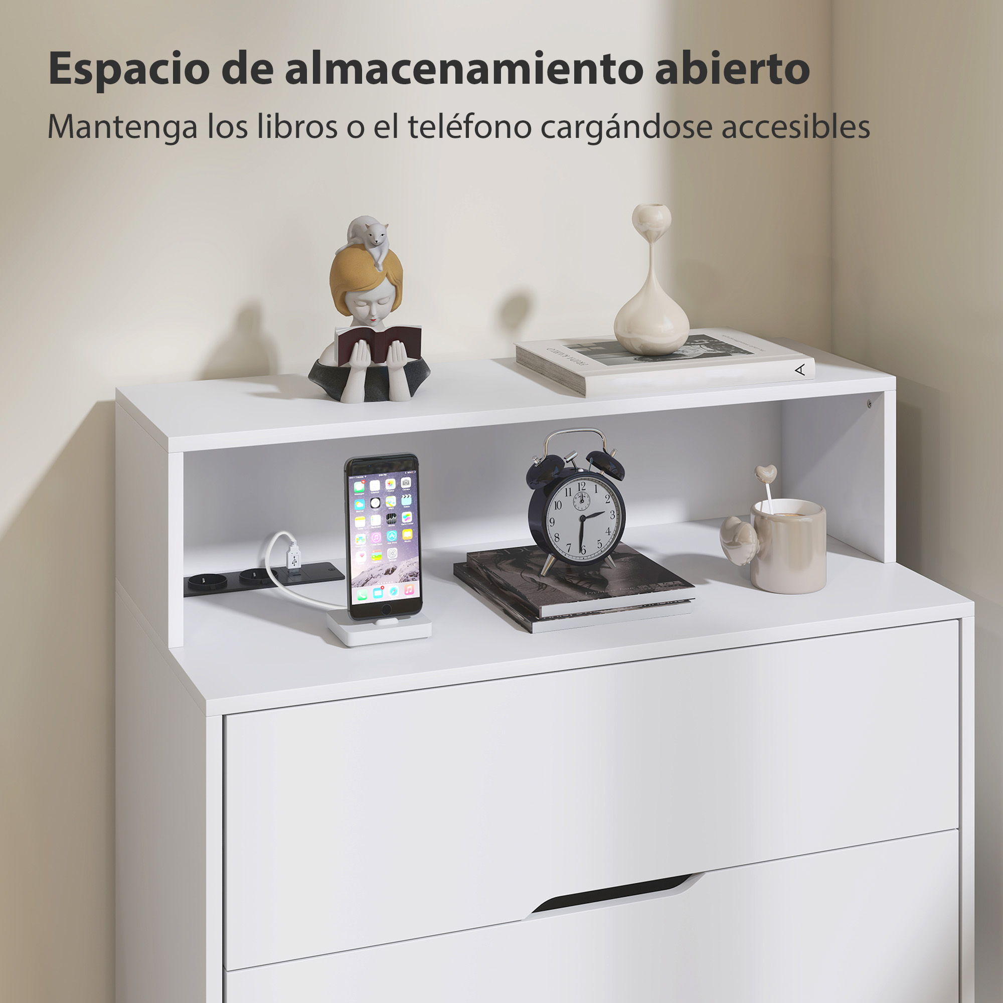 Una mesita de noche blanca con un estante que sostiene un teléfono, despertador y taza.