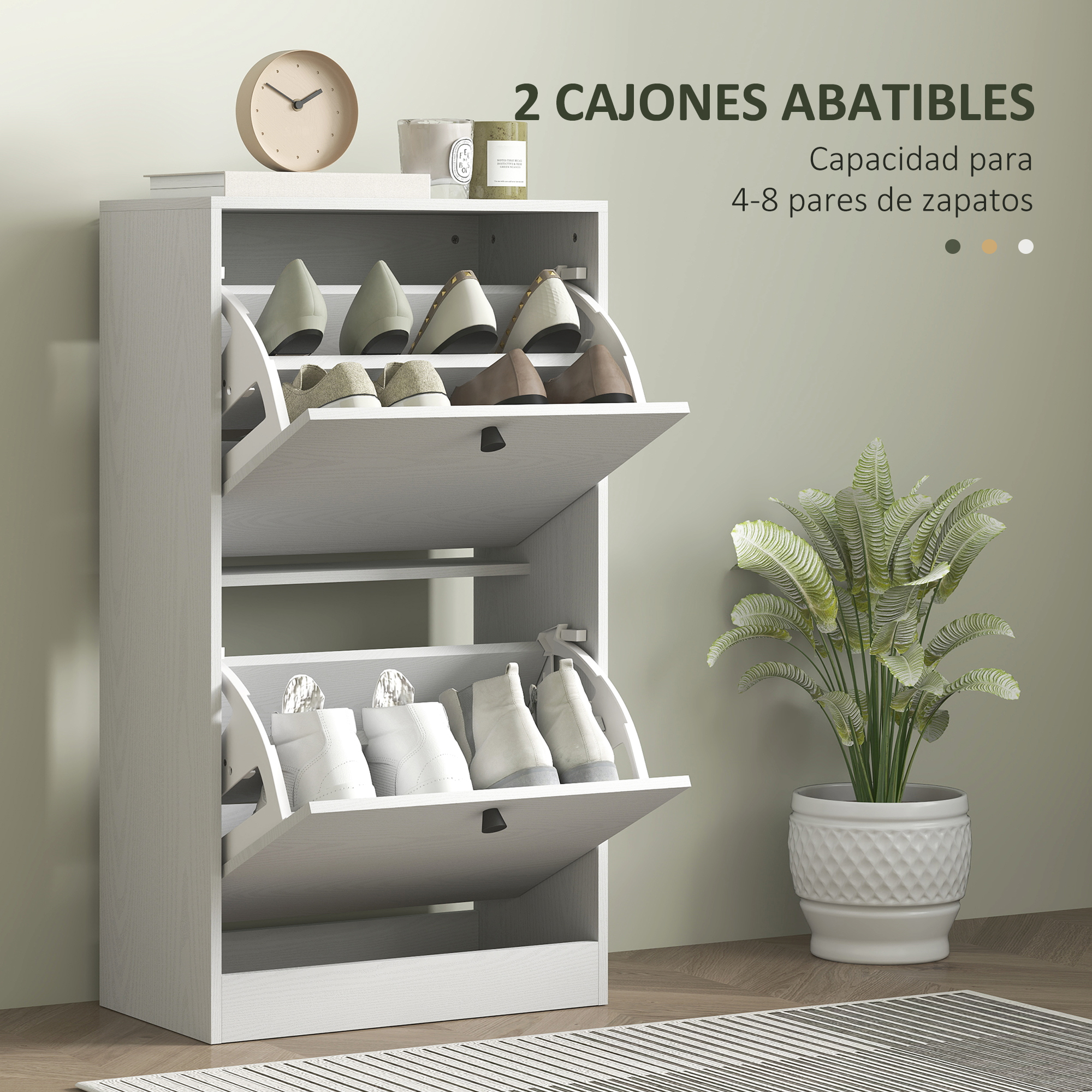 Un zapatero blanco con 2 puertas abatibles, lleno de zapatos. Una planta está al lado.