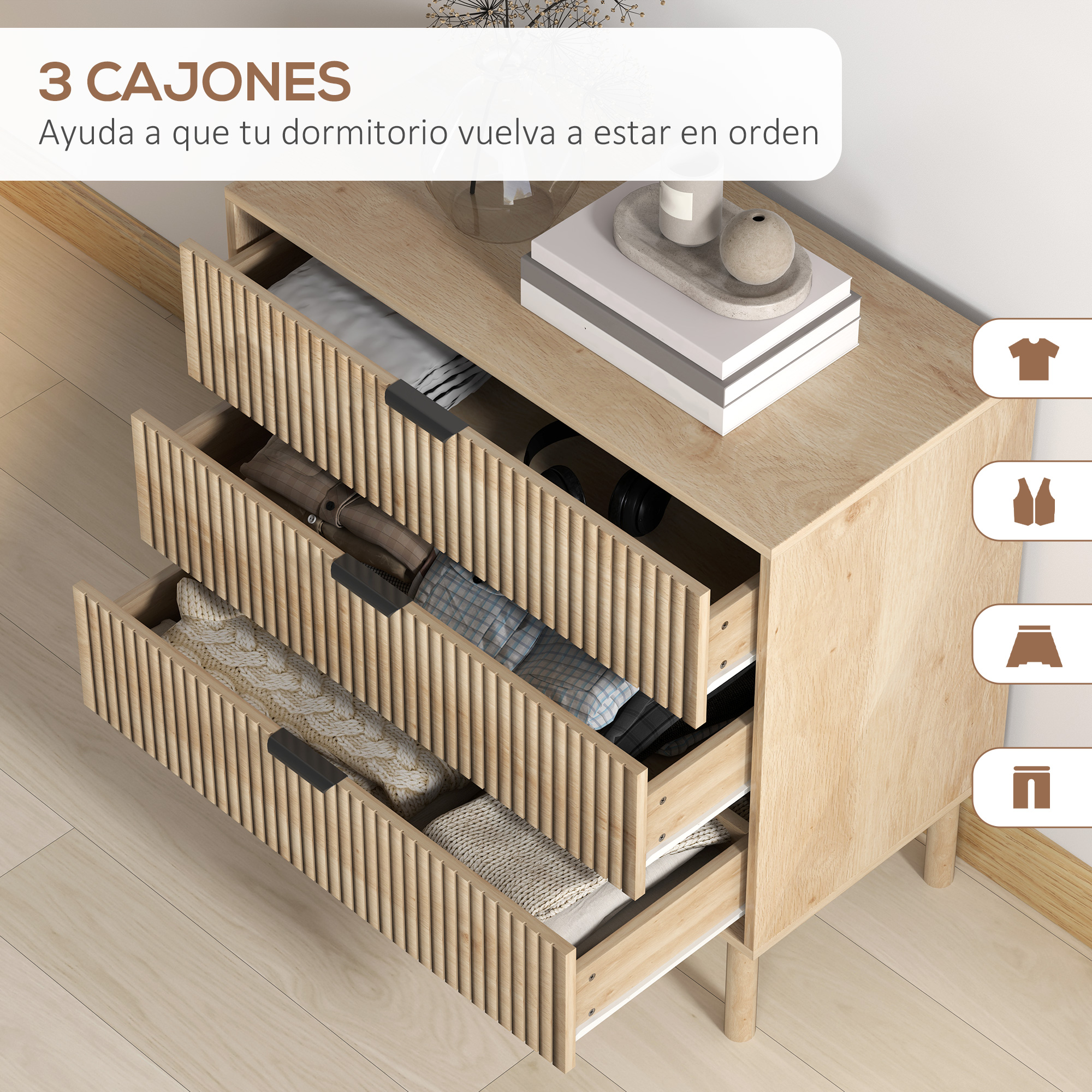 Cómoda de madera con tres cajones, llena de ropa y mantas.