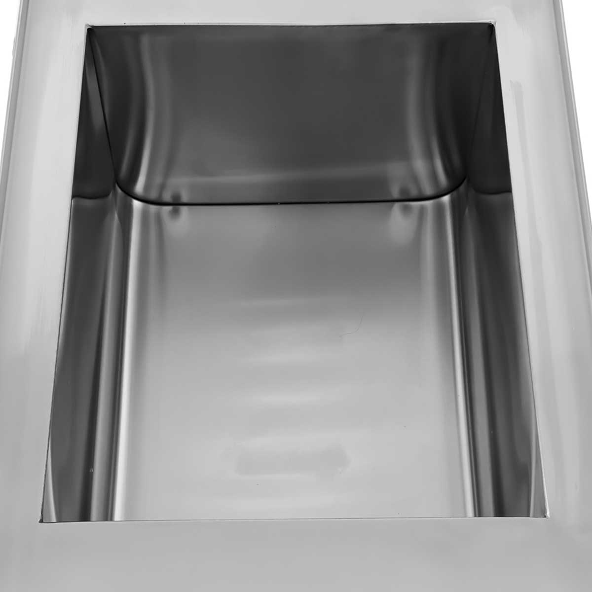 An empty, shiny metal container viewed from above.