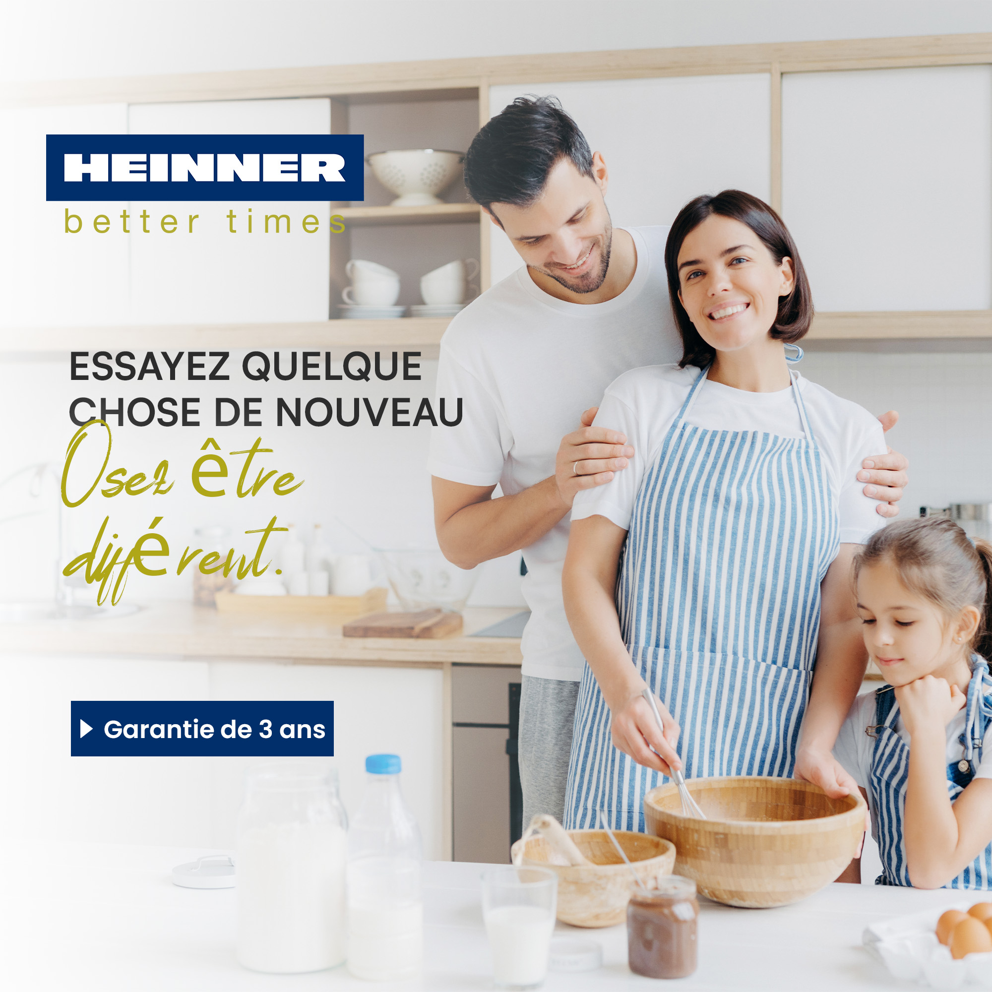 A family prepares something in the kitchen. A man, woman, and child smile.