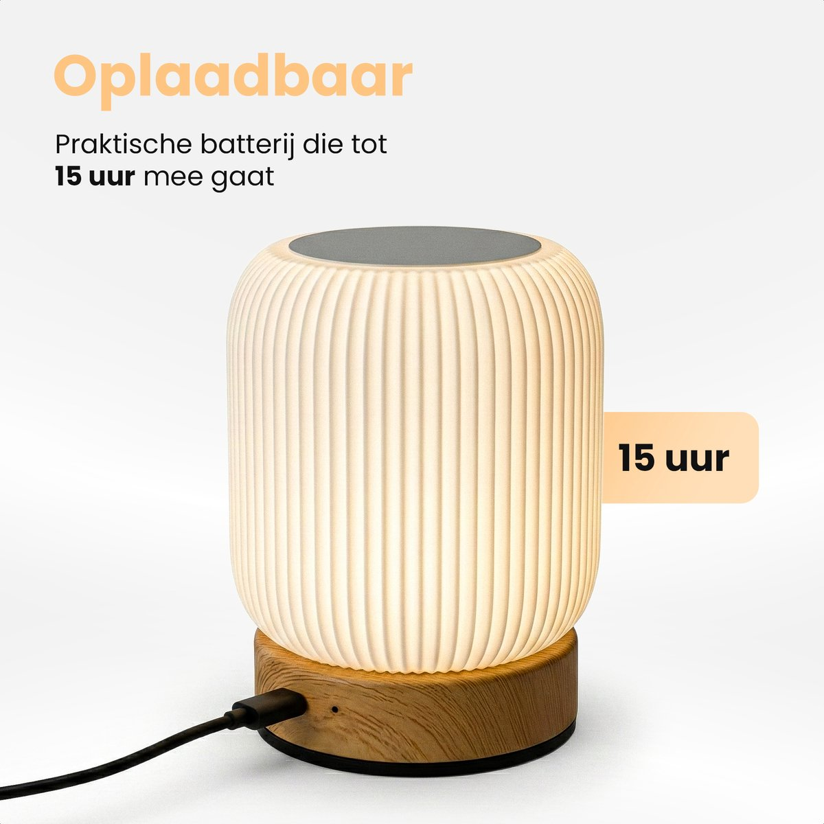 A white, ribbed lamp with a wooden base and USB cable, lasting 15 hours.